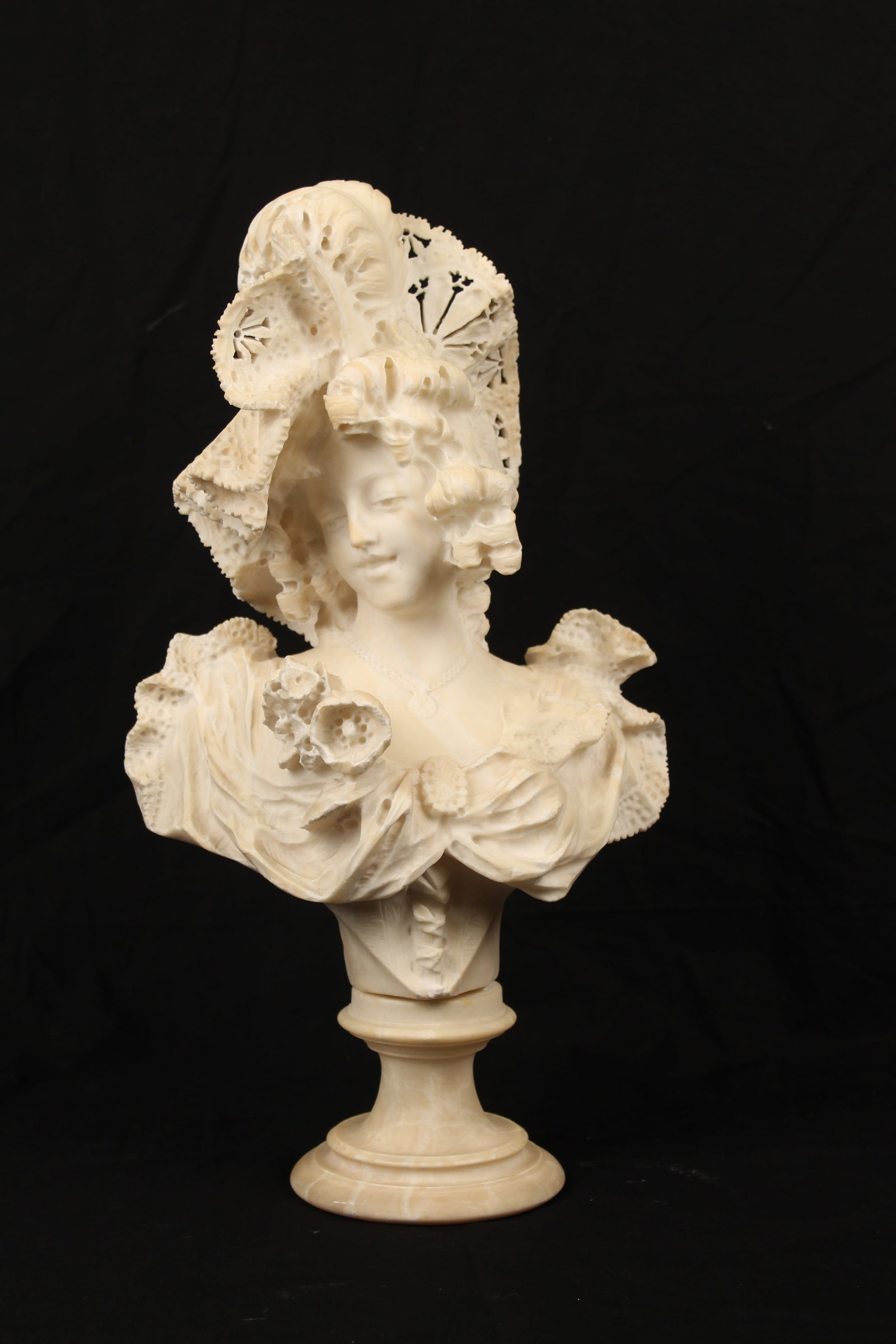 Giovanni Brogi (Italian, 1853-1919) Alabaster Bust of a Lady: Description: An elaborate alabaster bust of a young woman on a circular socle. Markings & Inscriptions: Signed Date: Late 19th century Maker: Giovanni Brogi (Italian, 1853-1919) Dimensions: 21.5" x 11