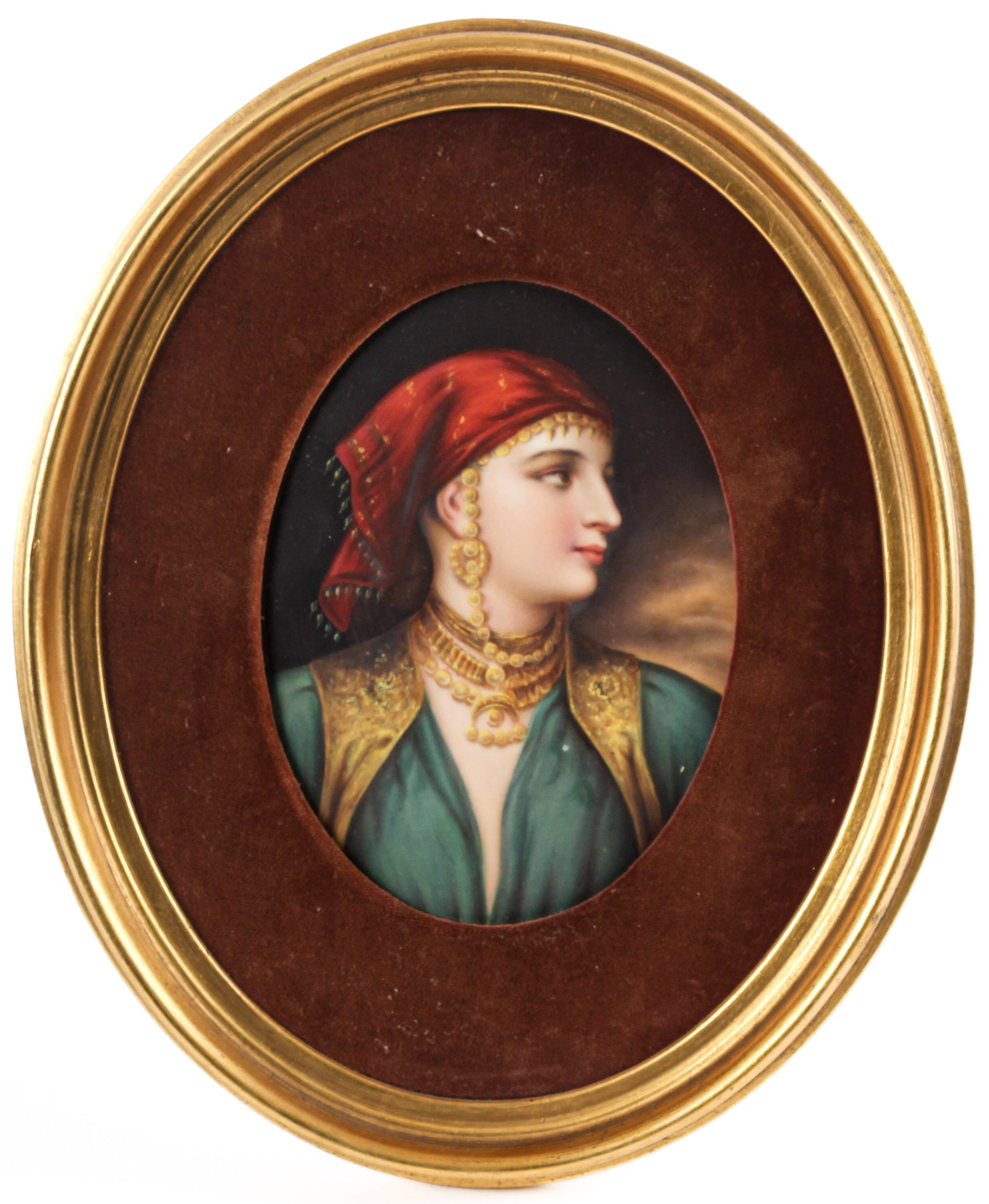 19th Century Berlin Porcelain Portrait Plaque of an Orientalist Beauty After Gustav Richter: Description: Hand-painted porcelain portait plaque depicting an Orientalist beauty wearing a red headscarf and gilt vest over a green shirt. Markings & Inscriptions: No visible signatures or marks Dat