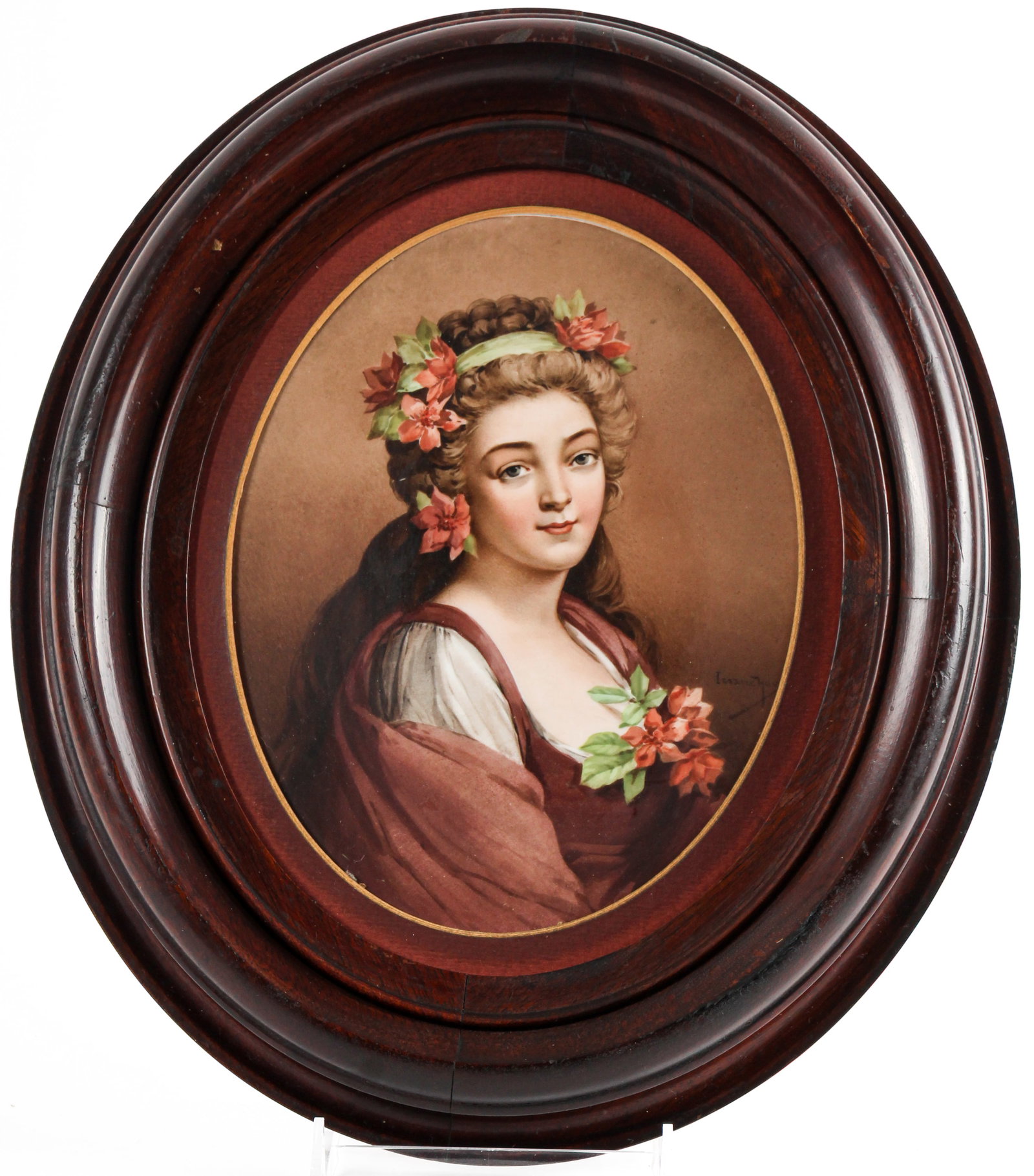 19th Century Berlin Porcelain Portrait Plaque of a Young Woman: Description: Hand-painted porcelain portrait plaque of a young woman with red flowers in her hair and at her neckline. Markings & Inscriptions: Impressed mark verso with additional inscription obscure