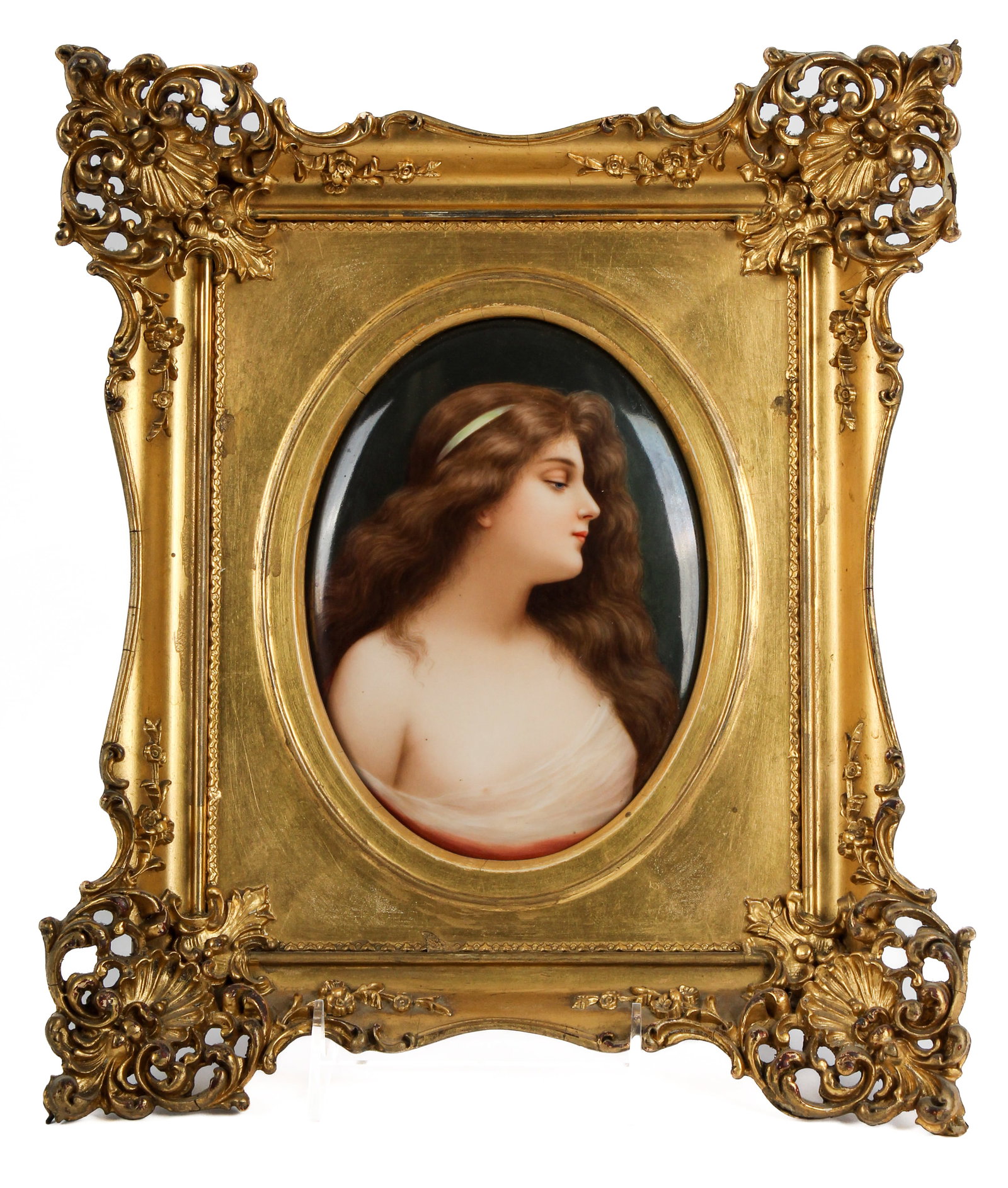 KPM Porcelain Portrati Plaque After Angelo Asti: Description: A hand painted KPM porcelain portrait plaque featuring a depiction of a young woman, after a painting titled "Unschuld" by Angelo Asti. Housed in a gilt gesso frame. Markings & Inscriptio