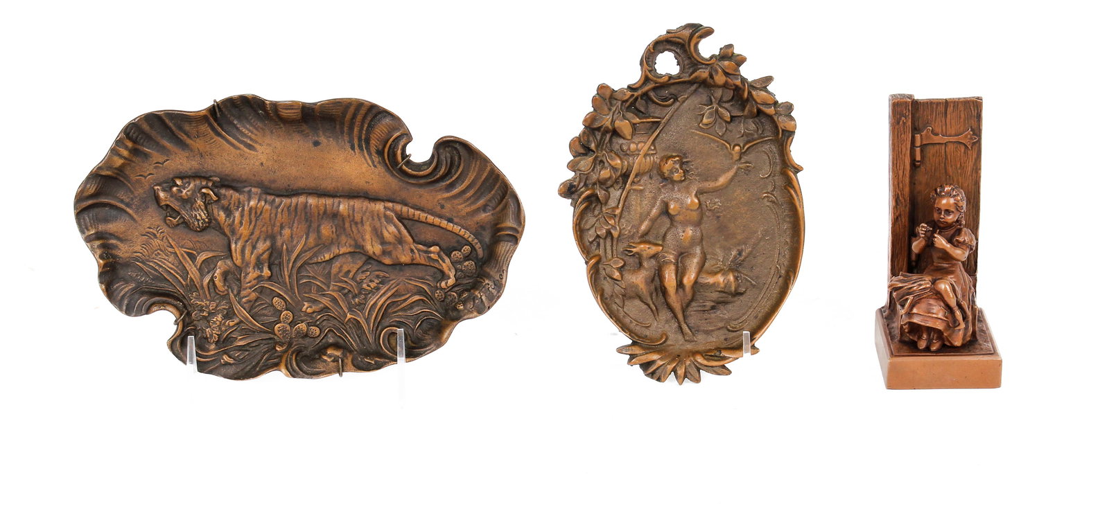 Three Bronze Items Incl. Geschutzt Girl With Doll, Tiger Dish: Description: Three estate bronze items including a dish decorated with a tiger in low relief by J. Fischer, an Austrian bronze figure of a girl repairing a doll, and an Art Nouveau dish decorated with