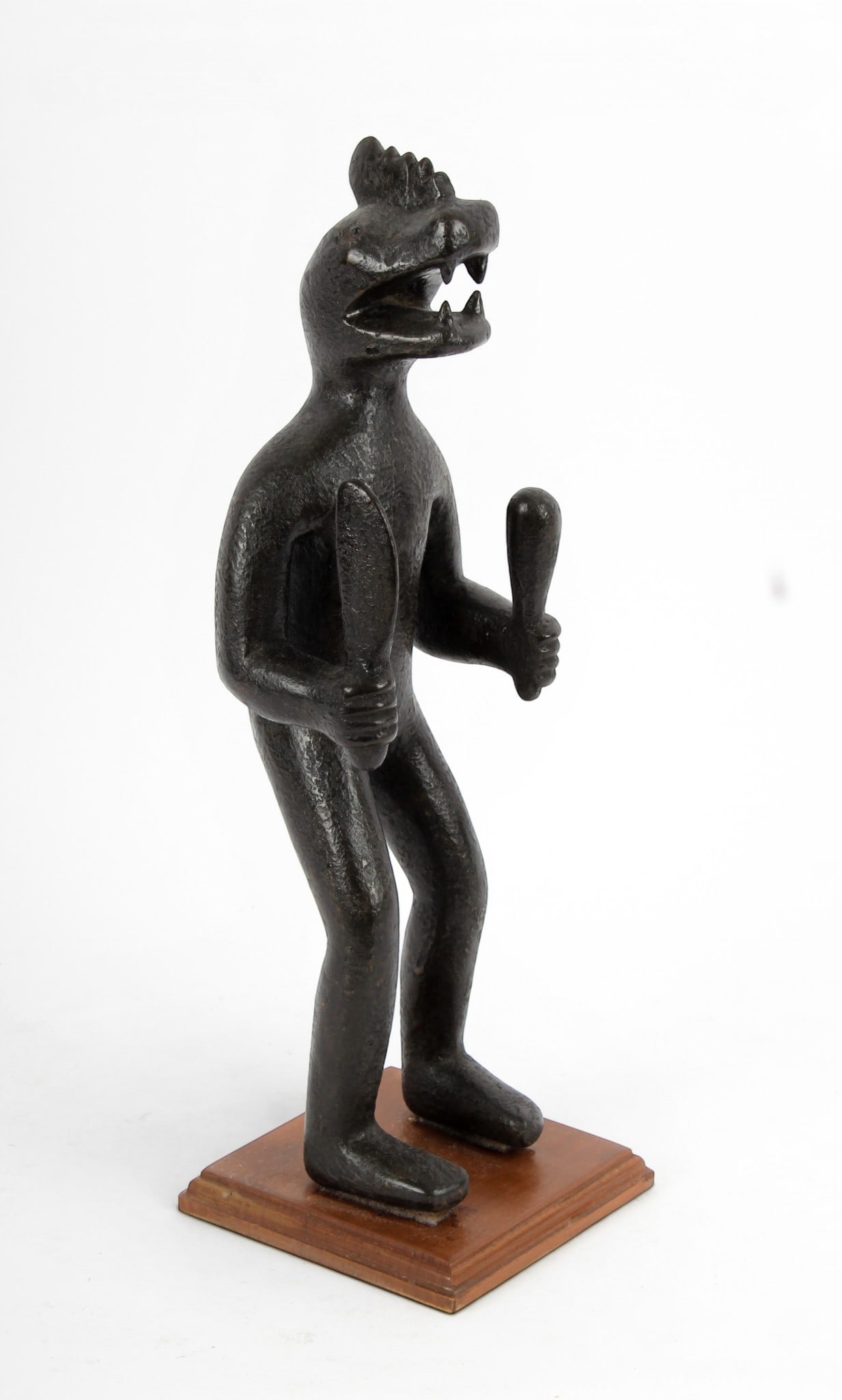 Outsider or Folk Art Figural Carving, Snake or Lizard-Human: Description: An outsider or folk art carving of an anthropomorphized reptile holding a club and blade or paddle. Markings & Inscriptions: Unmarked Date: 20th century Maker: Unknown Dimensions: 17" H. 