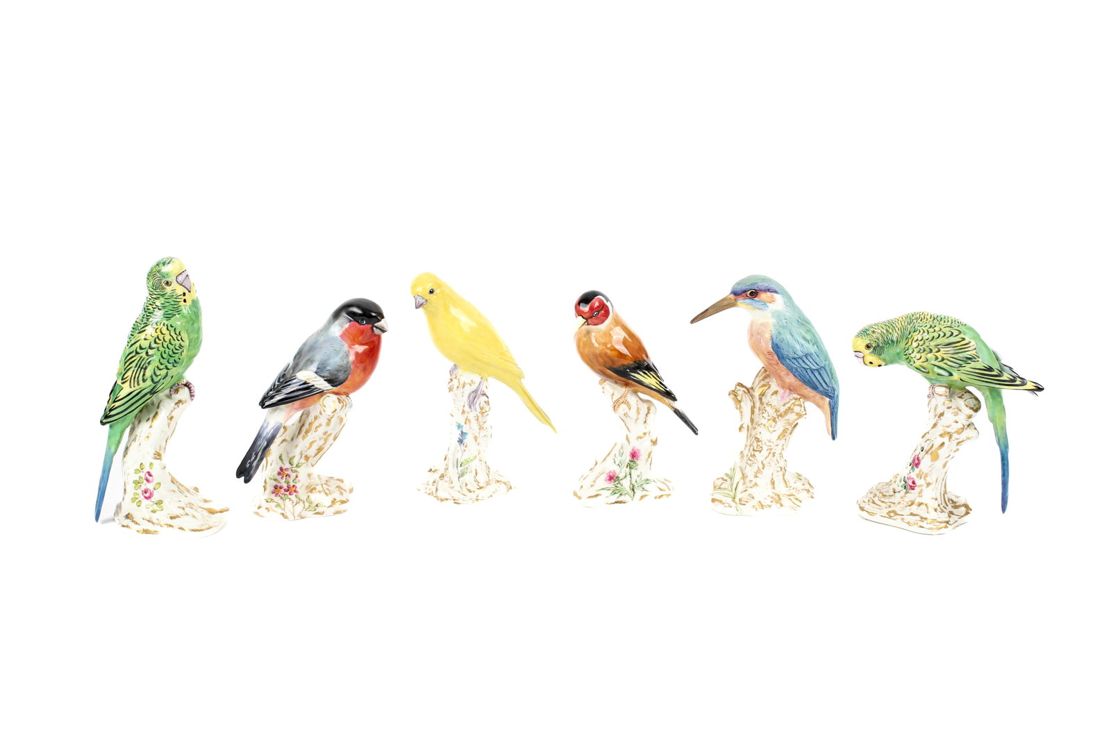 Six Royal Worcester Porcelain Bird Figurines, Frederick Gertner: Description: A group of Royal Worcester porcelain bird figurines modeled by Frederick Gertner. Shapes 2662-2667 (bullfinch on stump, female paroquet on stump, male paroquet on stump, canary on stump, 