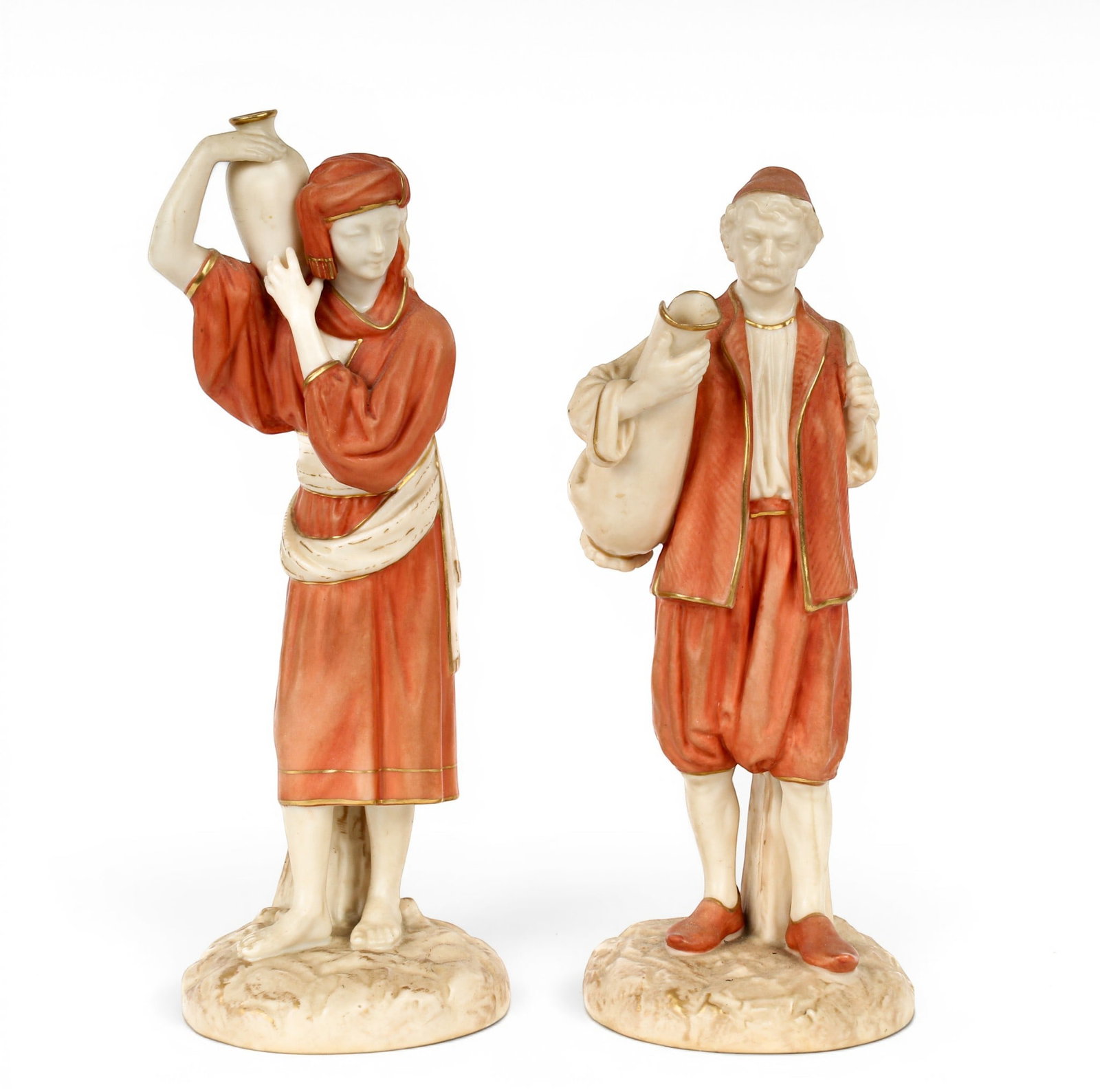 Royal Worcester Porcelain Water Carrier Figurines, James Hadley: Description: Two porcelain water carrier figurines with gilt accents in the Orientalist taste, in ivory and salmon tones. Designed by James Hadley. Additional Royal Worcester items from the estate of 