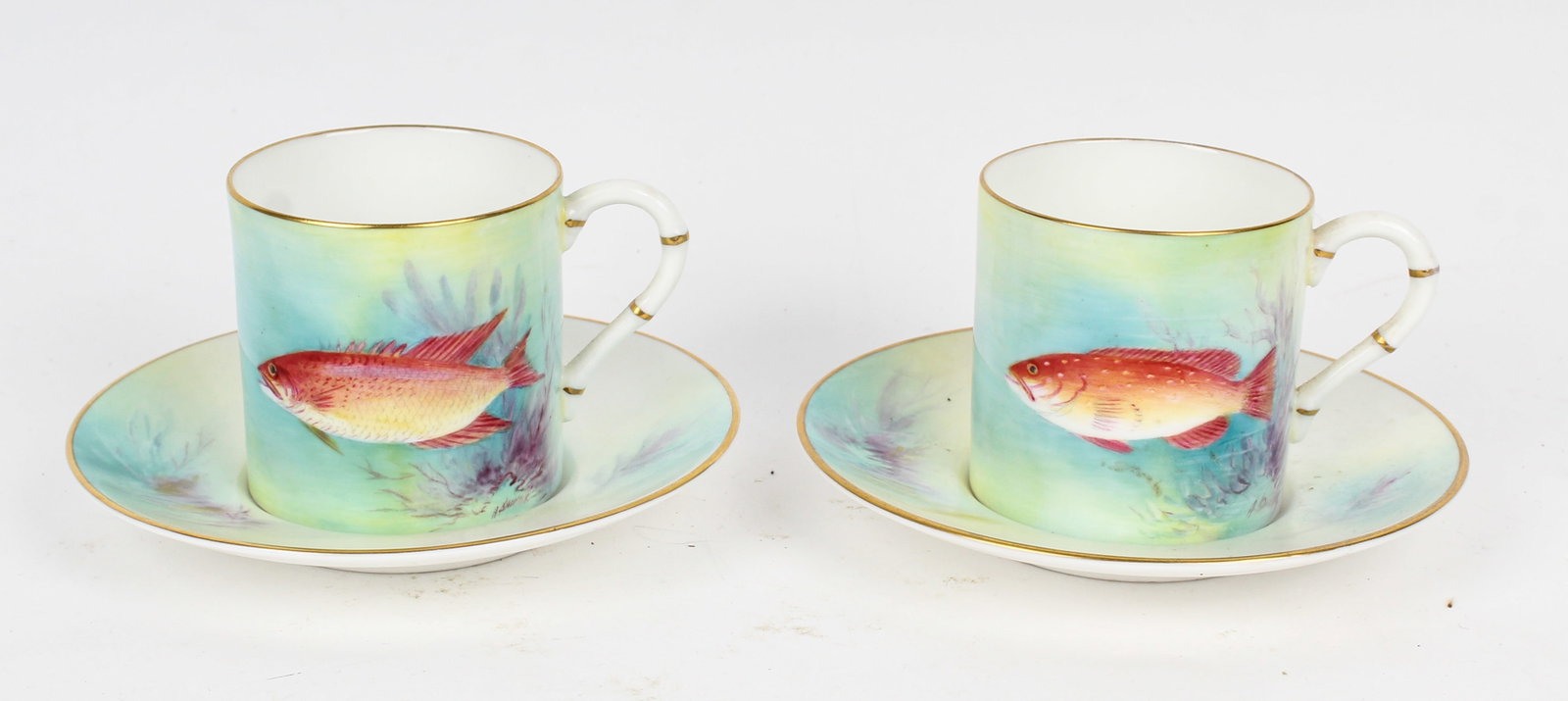 Pair of Royal Worcester Porcelain Demitasse Cups and Saucers: Description: Two Royal Worcester hand painted porcelain cups and saucers. Each cup decorated with a fish and sealife. The undersides labeled 'Spanish Hog' and 'Hind.' Additional Royal Worcester items 