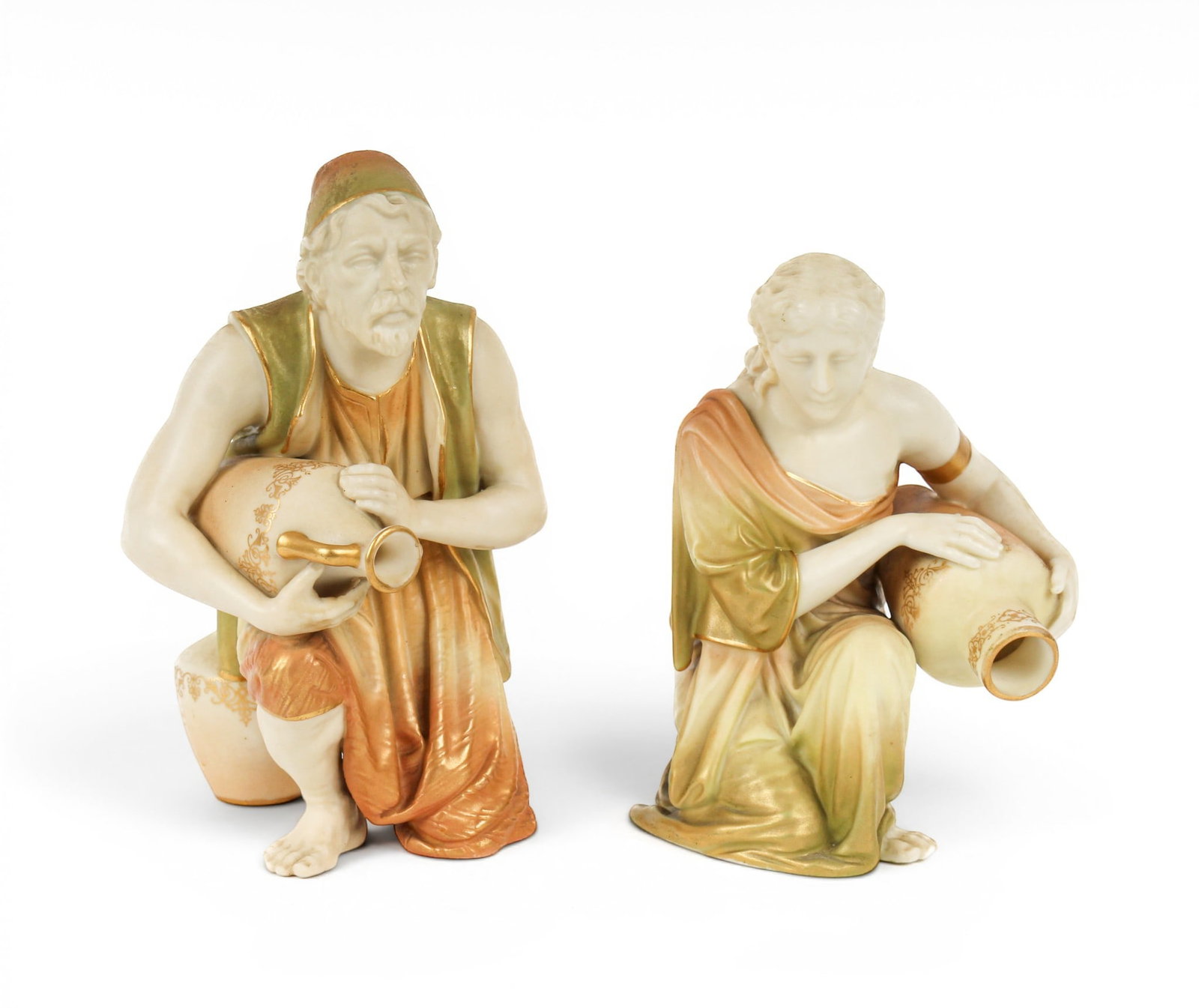 Pair of Royal Worcester Porcelain Figural Water Carriers: Description: Pair of Royal Worcester male and female water carriers, each holding an amphora. Additional Royal Worcester items from the estate of Stuart Brown will be featured in our upcoming auctions