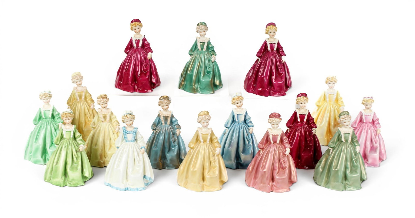 Royal Worcester Grandmother's Dress Figurines, F.G. Doughty: Description: A collection of fifteen "Grandmother's Dress" porcelain figurines, modeled by Freda Doughty for Royal Worcester. Additional Royal Worcester items from the estate of Stuart Brown will be f