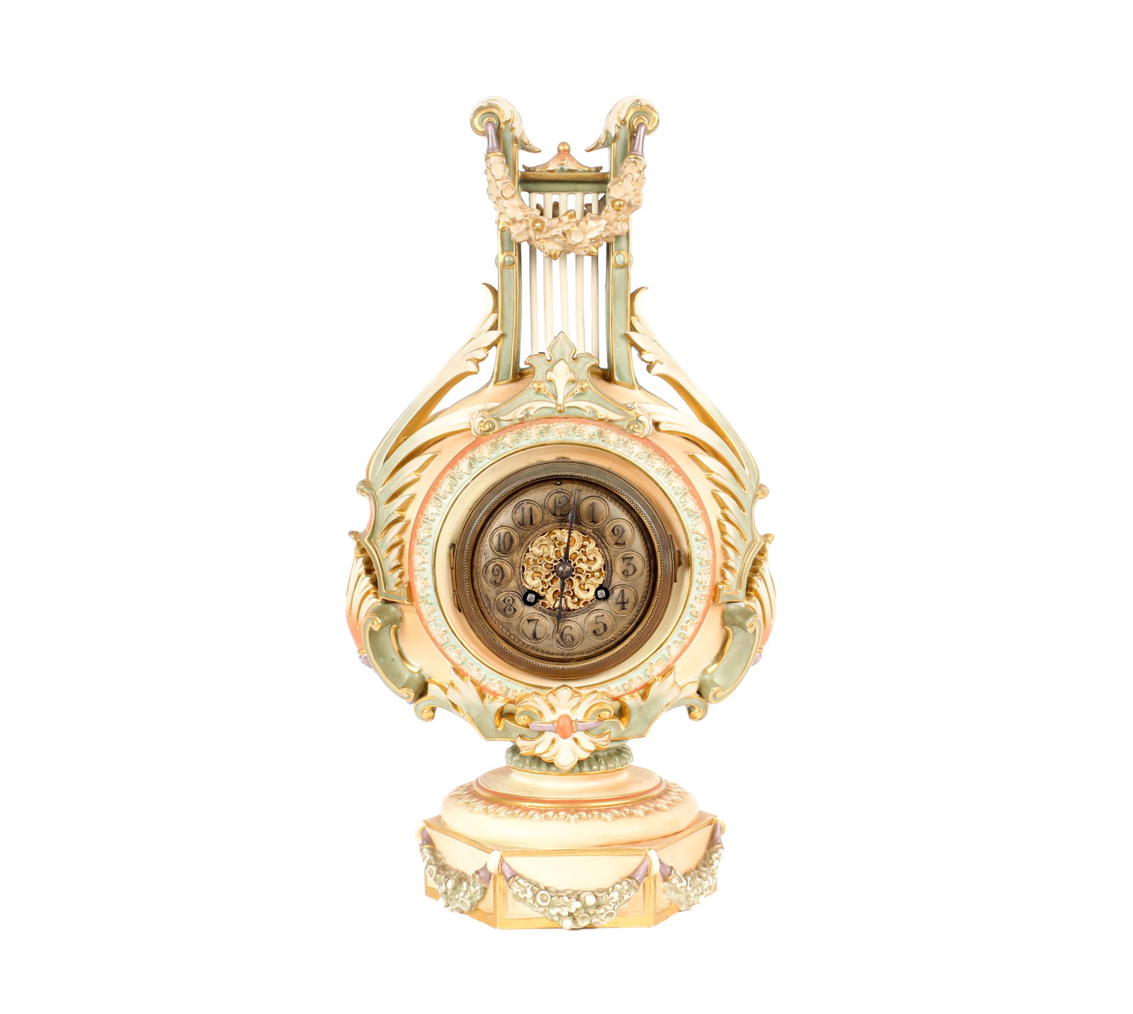 A Royal Worcester Porcelain Lyre Form Clock, Samuel Marti Movement: Description: A lyre form clock in a matte finish with gilt bronze and metal dial and hexagonal base, foliate and garland decoration, and a movement by Samuel Marti. Additional Royal Worcester items fr