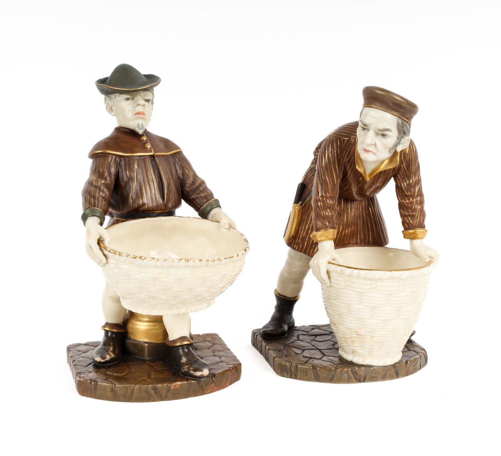 Royal Worcester Porcelain Basket Carrier Figurines: Description: Two porcelain figures of men carrying baskets in primarily brown tones with gilt highlights. Additional Royal Worcester items from the estate of Stuart Brown will be featured in our upcom