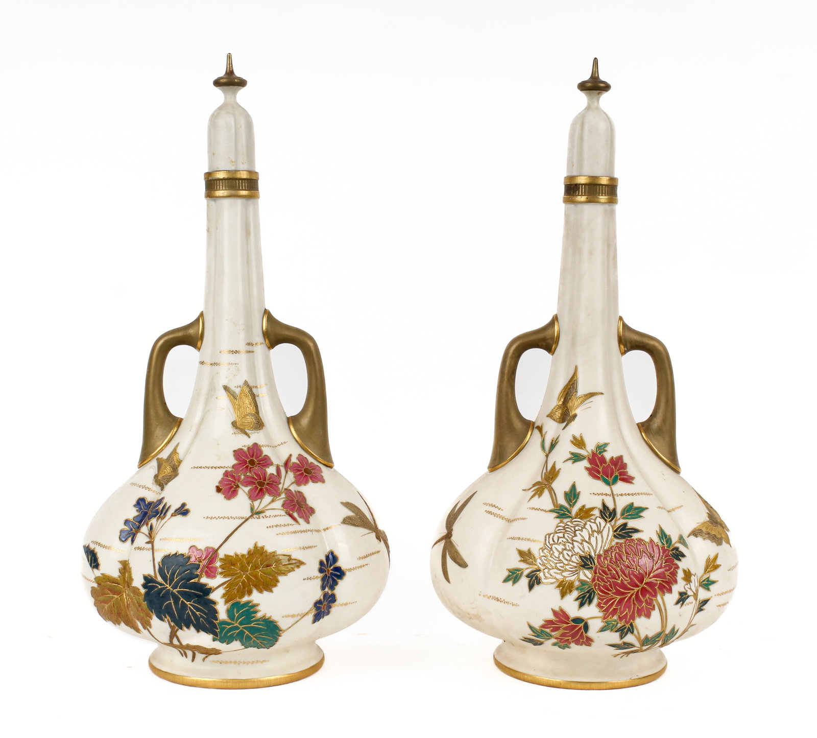 Royal Worcester Blush Ivory Porcelain Bottle Vases: Description: Two porcelain bottle vases with removable stoppers, in Blush Ivory, decorated with floral sprays, butterflies, and insects, each having a lobed body and two handles. Additional Royal Worc