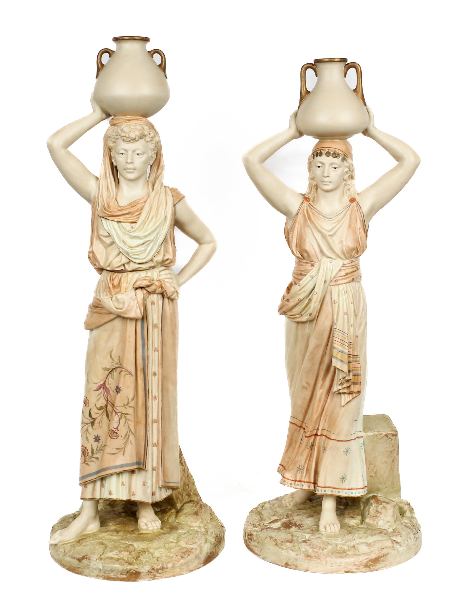 Large Pair of Royal Worcester Female Water Carriers, James Hadley: Description: Large pair of Royal Worcester blush porcelain female water carriers designed by James Hadley. Each depicted with water vessels supported on their heads and on naturalistic bases. Addition