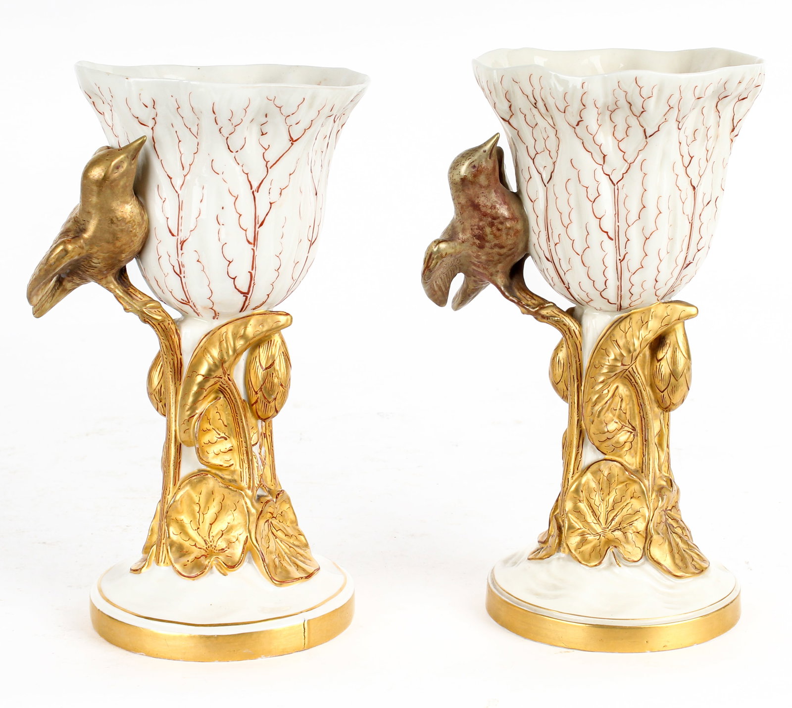 Pair of Royal Worcester Porcelain and Gilt Decorated Chalices or Goblets: Description: Pair of Royal Worcester porcelain and gilt decorated chalices or goblets. The bowl modeled after a flower with a large relief gilt decorated bird above a clustered foliate stem on a round