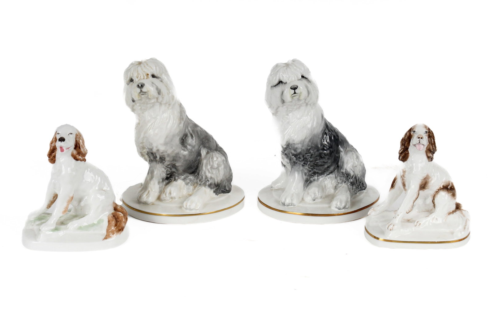 Four Royal Worcester Porcelain Figurines of Dogs, Kenneth Potts: Description: Group of four Royal Worcester porcelain figurines of dogs designed by Kenneth Potts. Including two pairs, one of seated Springer Spaniels and a pair of seated Old English puppies. Additio