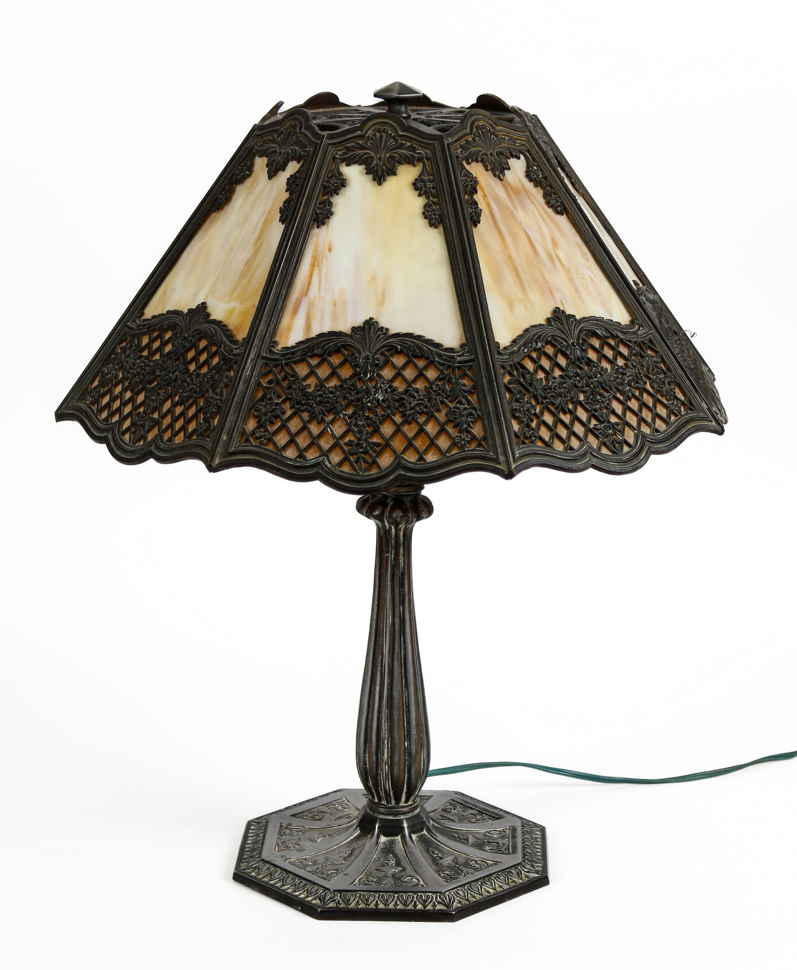 Bradley & Hubbard Slag Glass Table Lamp: Description: A table lamp with paneled carmel slag glass shade. Markings & Inscriptions: Marked Date: Early 20th century Maker: Bradley & Hubbard Dimensions: 21.5' x 16". Provenance: From a Phoenixvil