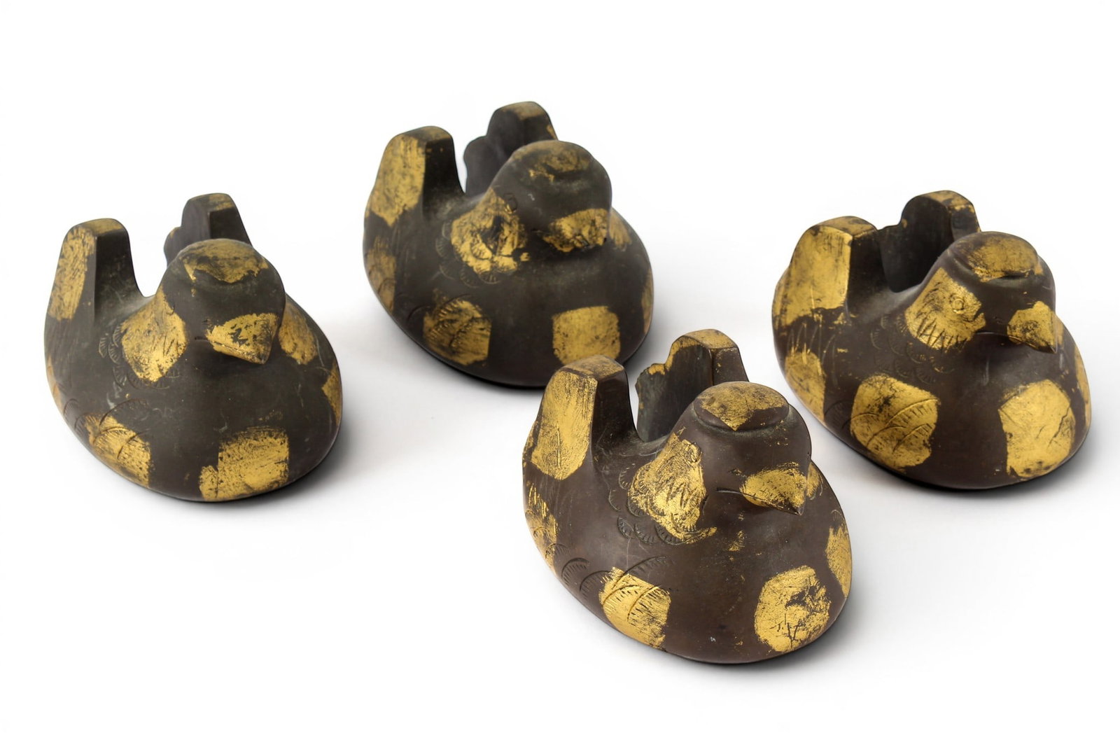 Four Japanese Meiji Bronze Screen Holder Ducks: Description: A group of four bronze duck form byobu screen holders with gilt patches and engraved surfaces. Markings & Inscriptions: Unmarked Date: Early 20th century Maker: Japanese Dimensions: 3" x 