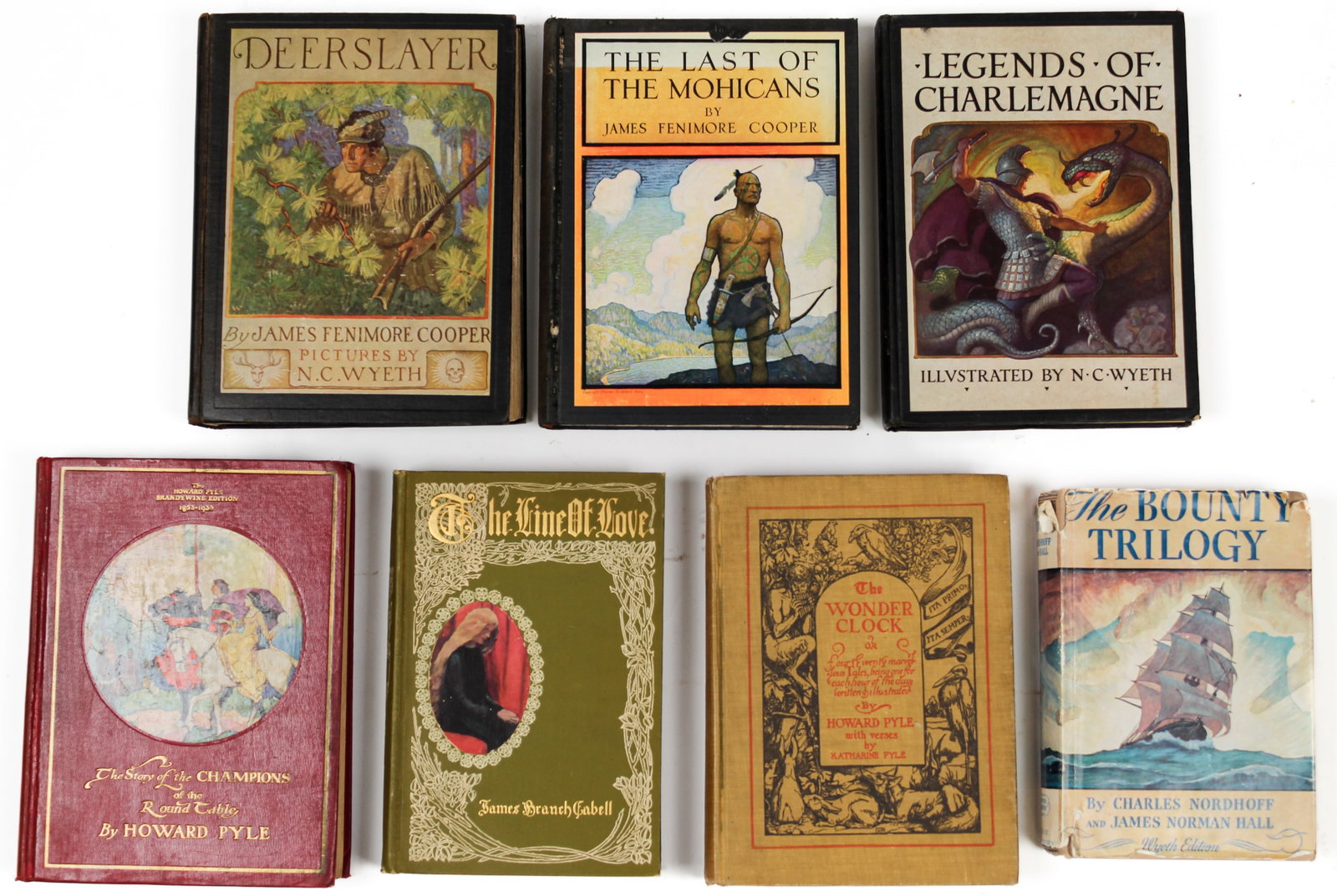 Books Illustrated by N.C. Wyeth and Howard Pyle: Description: A colleciton of seven books illustrated by N.C. Wyeth and Howard Pyle, including Legend of Charlemagne, The Last of the Mohicans, Deerslayer, The Story of the Champions of the Round Table