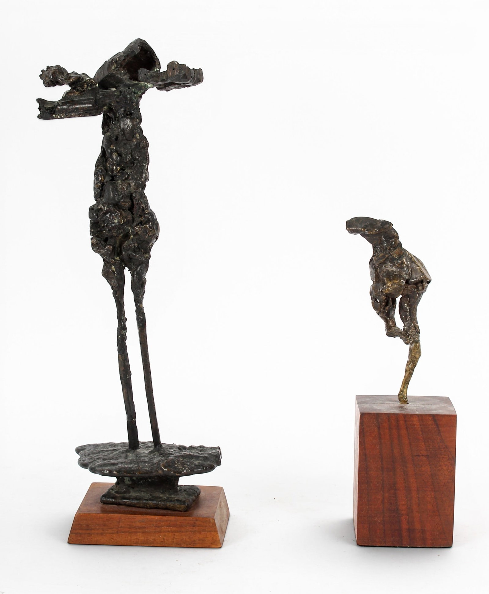 Two Mid Century Brutalist Figural Bronze Sculptures: Description: Two mid century brutalist bronze sculptures. Markings & Inscriptions: Unmarked Date: Mid 20th century Maker: American Dimensions: Larger: 16.25" H. Smaller: 11" H. Provenance: From a Lans