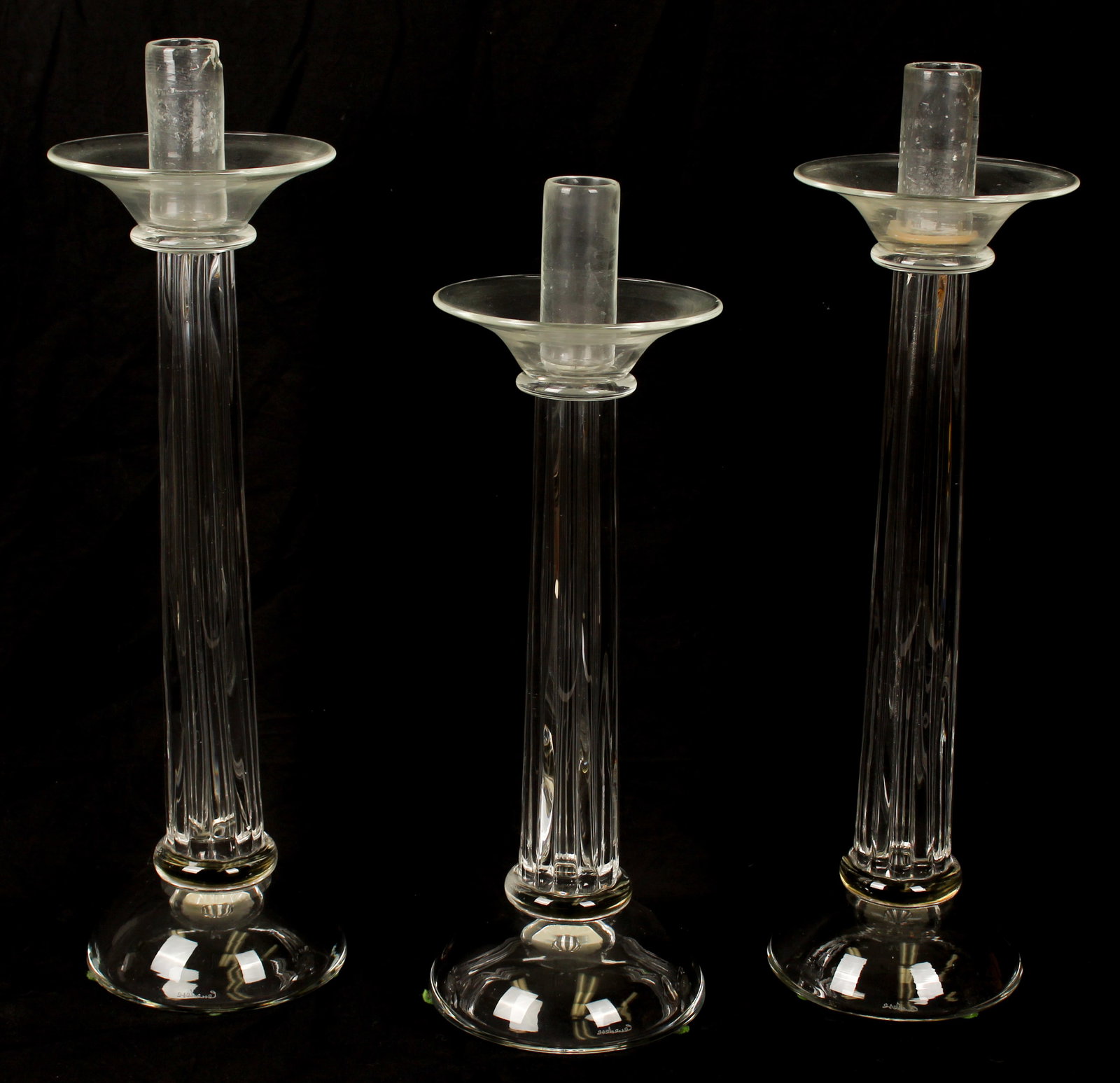 Large Cenedese Murano Candle Holders: Description: Three large hand blown clear glass candle holders. Markings & Inscriptions: Marked Date: Mid to late 20th century Maker: Cenedese Murano Dimensions: Larger: 23.5" H. Smaller: 20.5" H. Pro