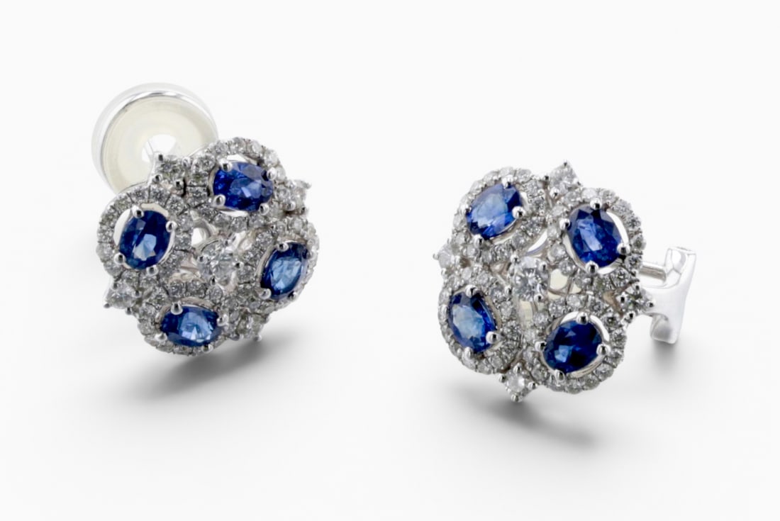 18K Sapphire and Diamond Earrings: Description: A pair of 18K white gold, diamond, and sapphire earrings, set with four approx. 0.25 Ct oval sapphires and round diamonds, approx total diamond weight 1.25 Carats. Markings &