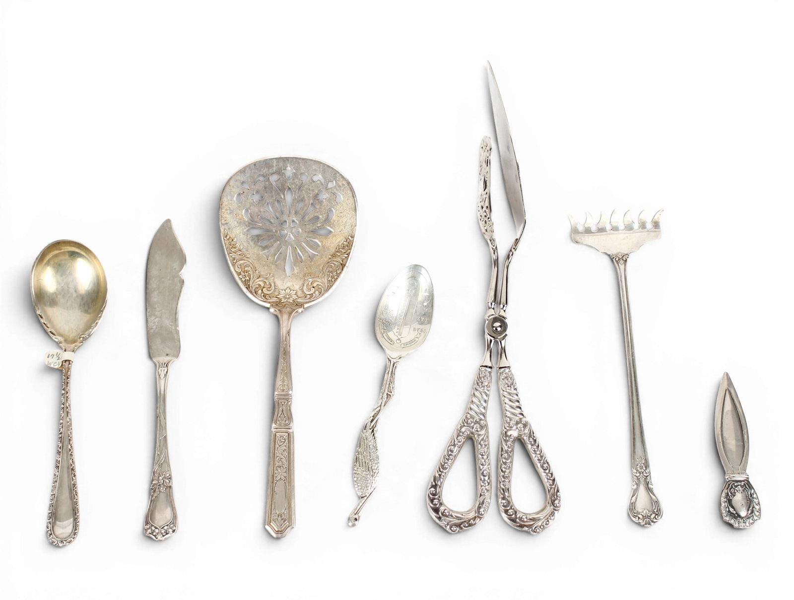 Sterling Silver Flatware, Etc.: Description: A group of assorted sterling and sterling-handled items, including a pierced tomato serving spoon by Gorham in the Saint Dunstan pattern, a birth record spoon (never used), a bookmark, a 
