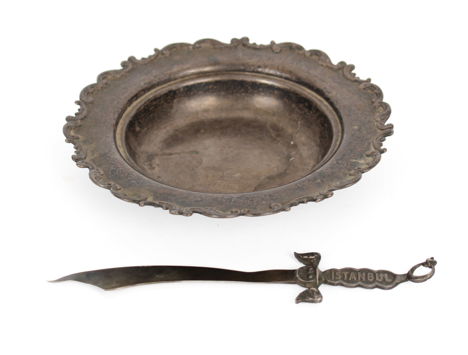 Sterling Silver Bowl, .800 Silver Istanbul Sword Letter Opener: Description: A sterling silver bowl with rocaille-decorated edge by Whiting and a Turkish .800 silver letter opener in the form of a sword. Markings & Inscriptions: Marked Date: 20th century Maker: Tu