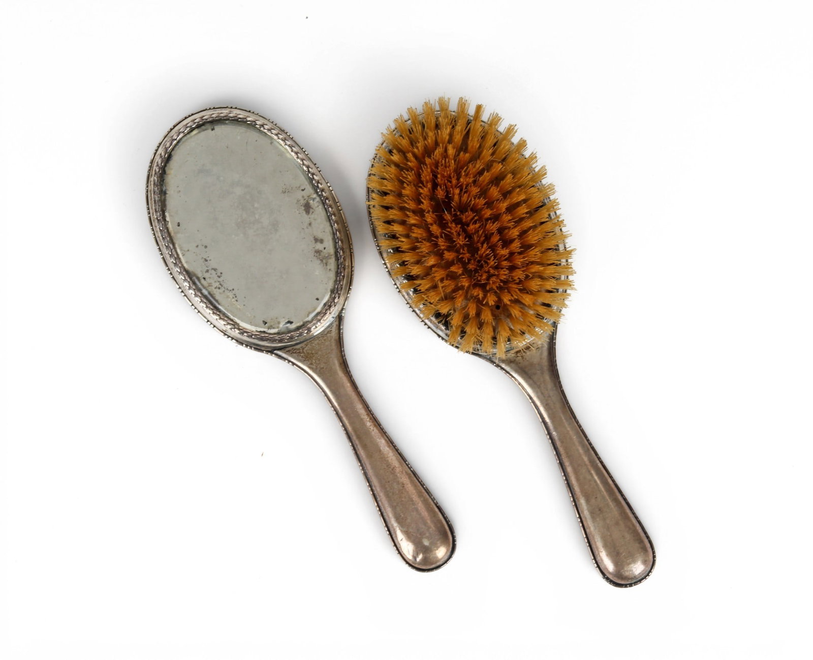 Joseph Marshak, Russian Silver Dresser Mirror and Brush: Description: A Russian Empire silver mirror and brush by Iosef Marshak of Kiev. Markings & Inscriptions: Marked Date: Early 20th century Maker: Joseph Marshak, Kiev Dimensions: The total weight is 11.