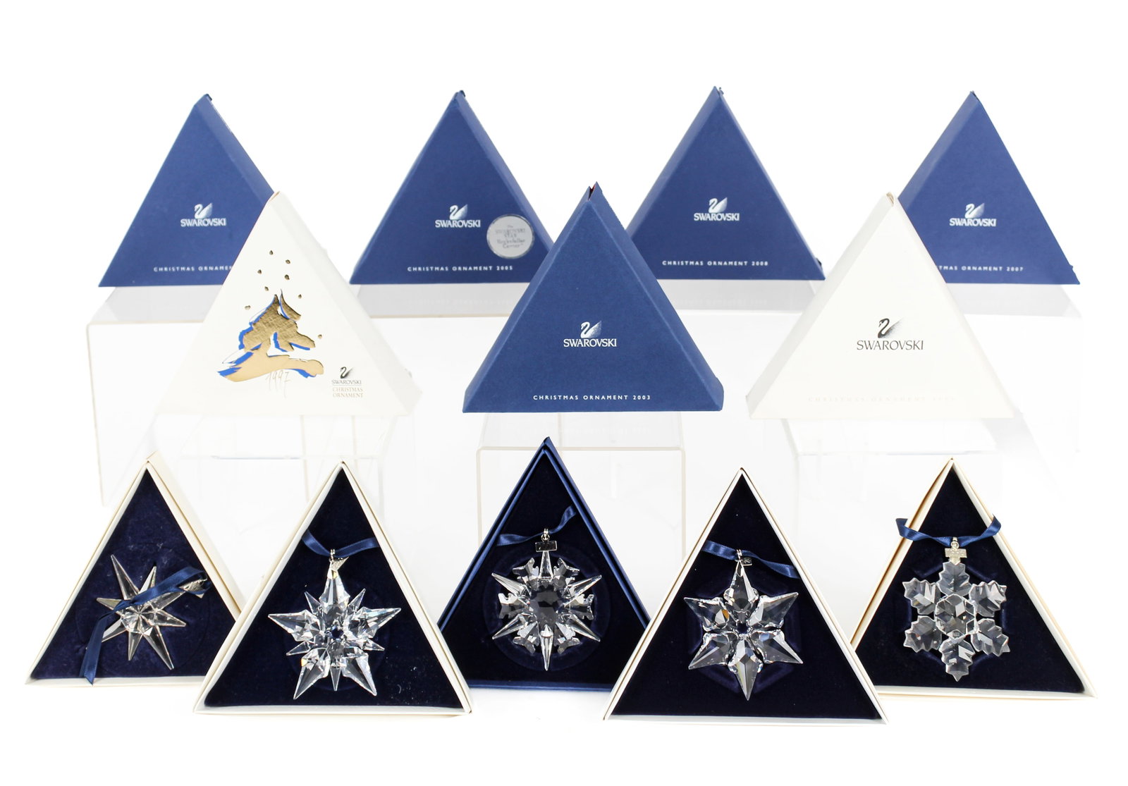 Collection of Swarovski Annual Christmas Ornaments: Description: A collection of Swarovski crystal annual Christmas ornaments, for the years 1995-1998, 2000-2003, 2005, 2007 (x2), 2008, with the original boxes.. Markings & Inscriptions: Marked Date: 19