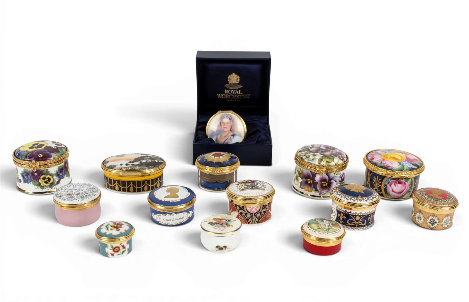 Collection of Porcelain and Enamel Trinket Boxes, Halcyon Days, Royal Worcester: Description: A group of assorted porcelain and enamel trinket boxes, several are commemorative celebrating English Royalty. Markings & Inscriptions: Marked Date: Late 20th-early 21st century Maker: Ro