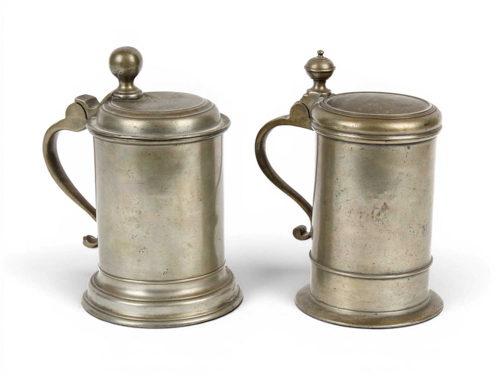18th Century German Pewter Tankards: Description: Two German pewter tankards, each marked on the underside of the lid, one inscribed with the name Samuel Schroder and date of 1782. Markings & Inscriptions: Marked Date: 18th-early 19th ce