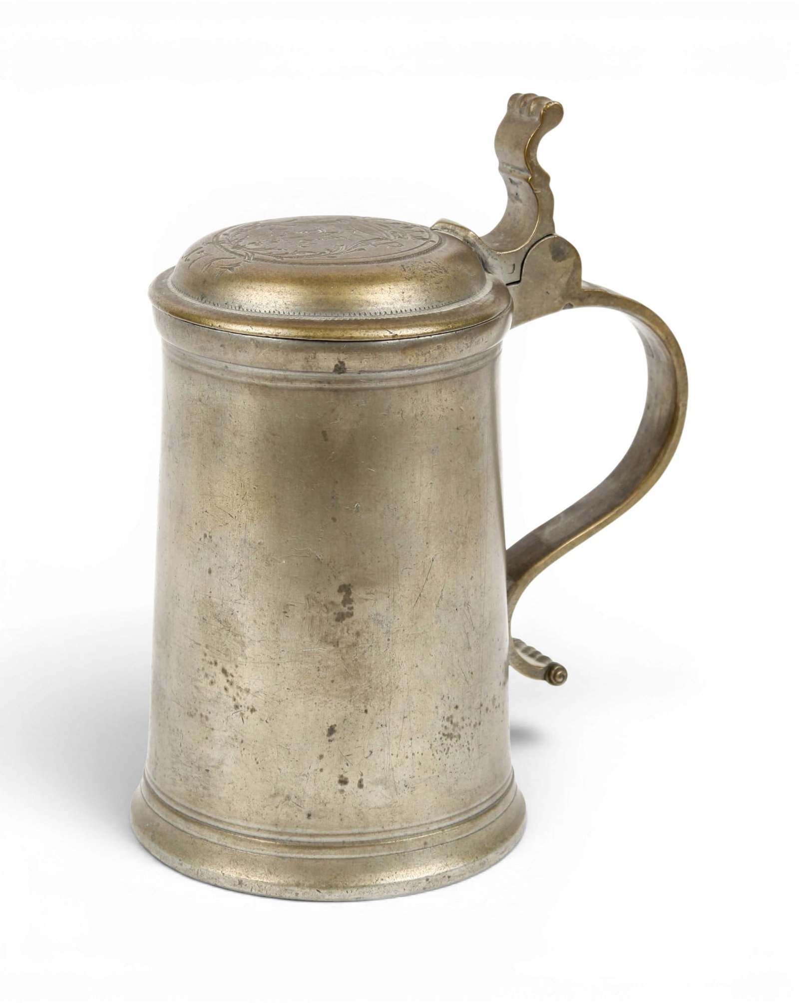 Johann Joseph Schmiderer (German, 18th C.) Pewter Tankard: Description: A German pewter tankard, the lid engraved with a coat of arms and dated 1764. Markings & Inscriptions: Marked with touchmarks underneath the lid Date: Mid 18th century Maker: Johann Josep