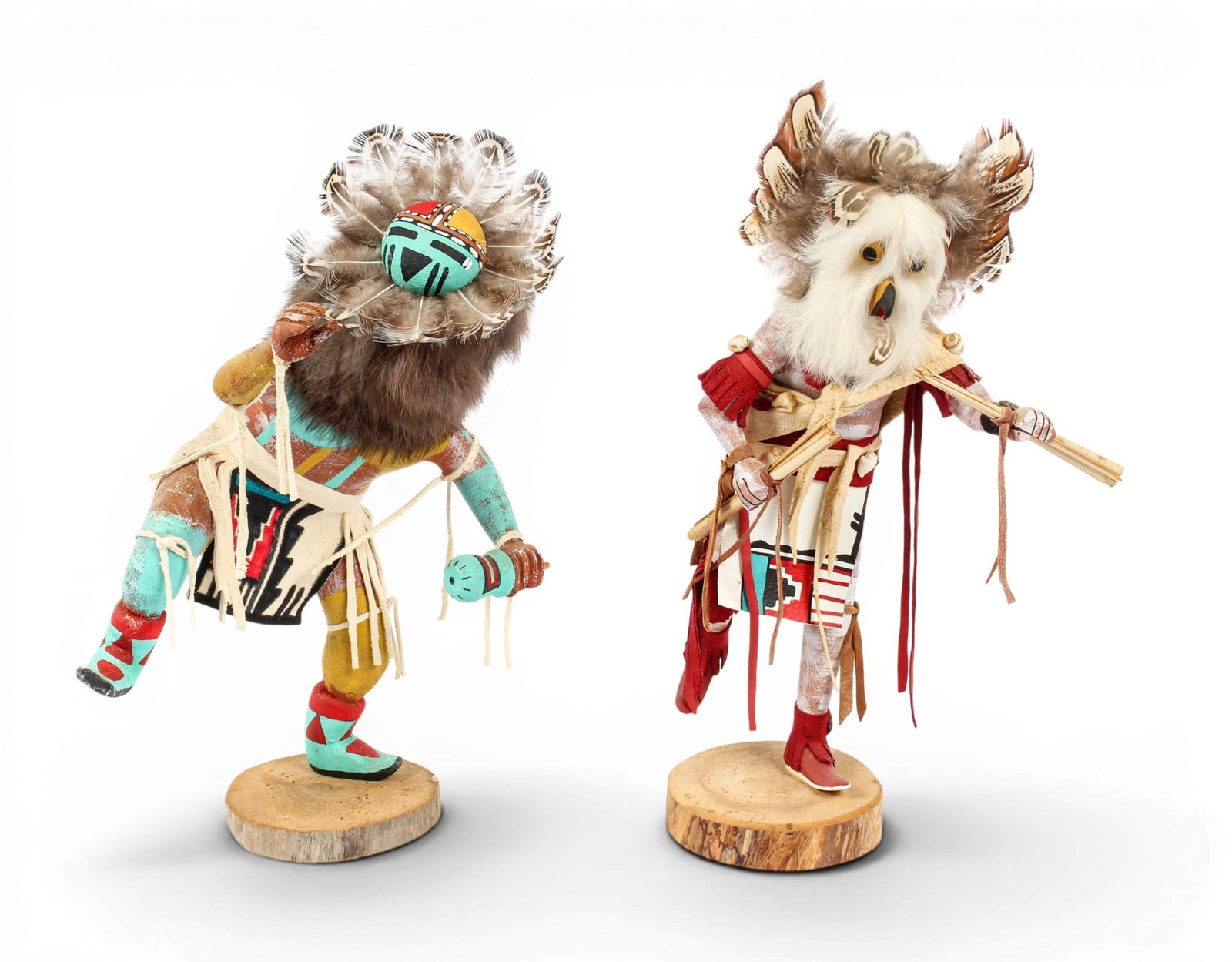 Two Signed Hopi Kachina Dolls With Feathers: Description: Two hand-carved and polychrome-painted Hopi Kachina dolls with feathers and leather details. One depicts the Sunface Kachina and is signed R.T., and the other depicts the Owl Kachina and 