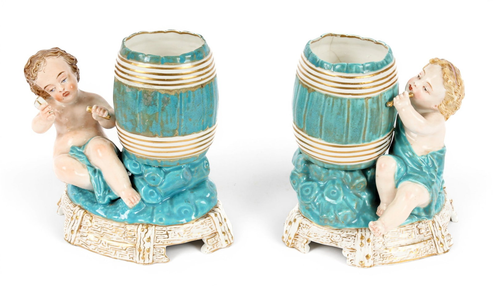 Pair of Royal Worcester Porcelain Cherub Spill Vases: Description: Pair of Royal Worcester porcelain spill vases each depicting a cherub and a barrel. Decorated in blue and white with gilt accents to the barrels and the stands. Markings & Inscriptions: M