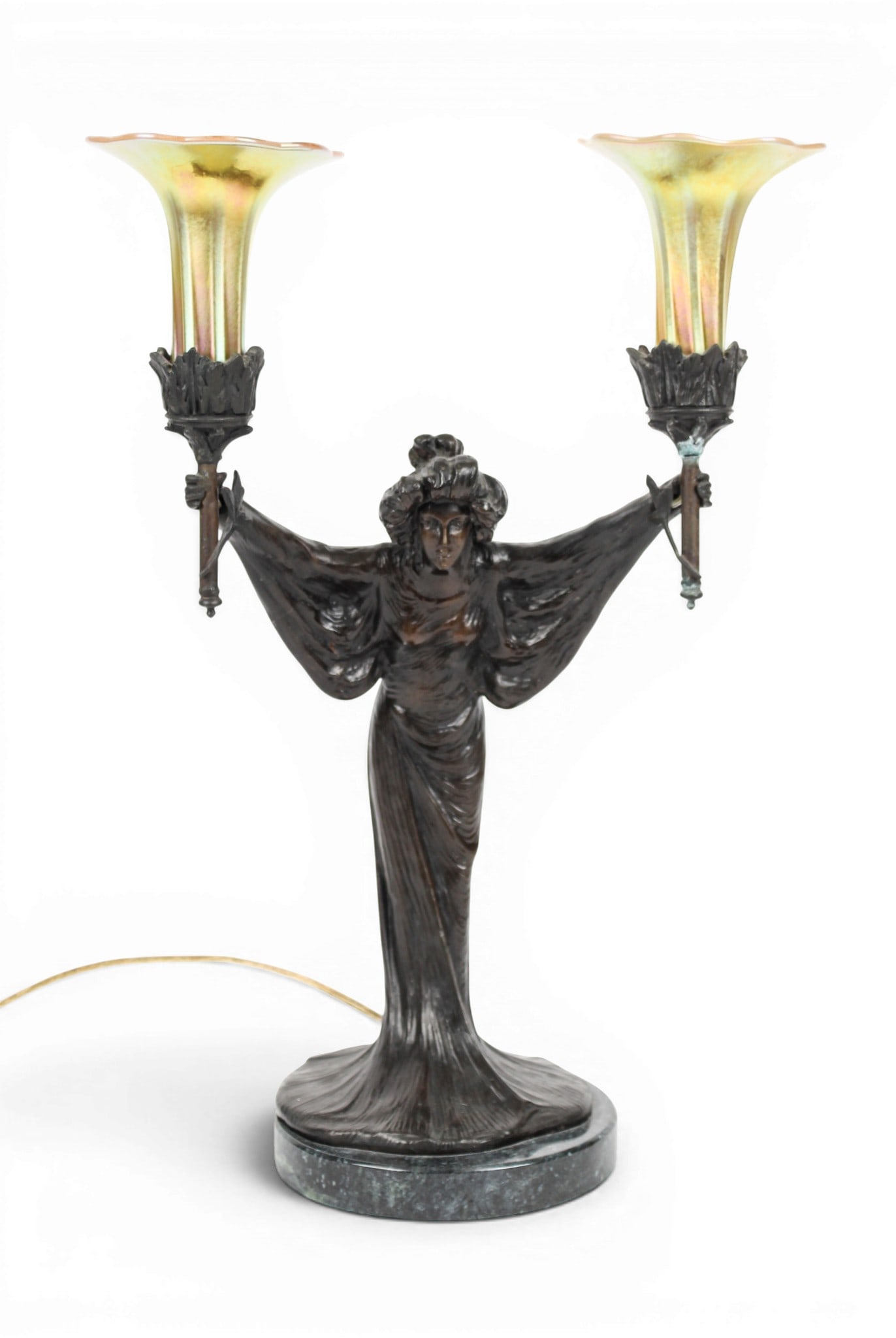Sculptural Bronze Art Nouveau Style Lamp After Emmanuel Villanis, Favrile Glass Shades: Description: An Art Nouveau style sculptural figural table lamp with two favrile glass shades. Markings & Inscriptions: Signed in the casting Date: Mid to late 20th century Maker: After Emmanuel Villa