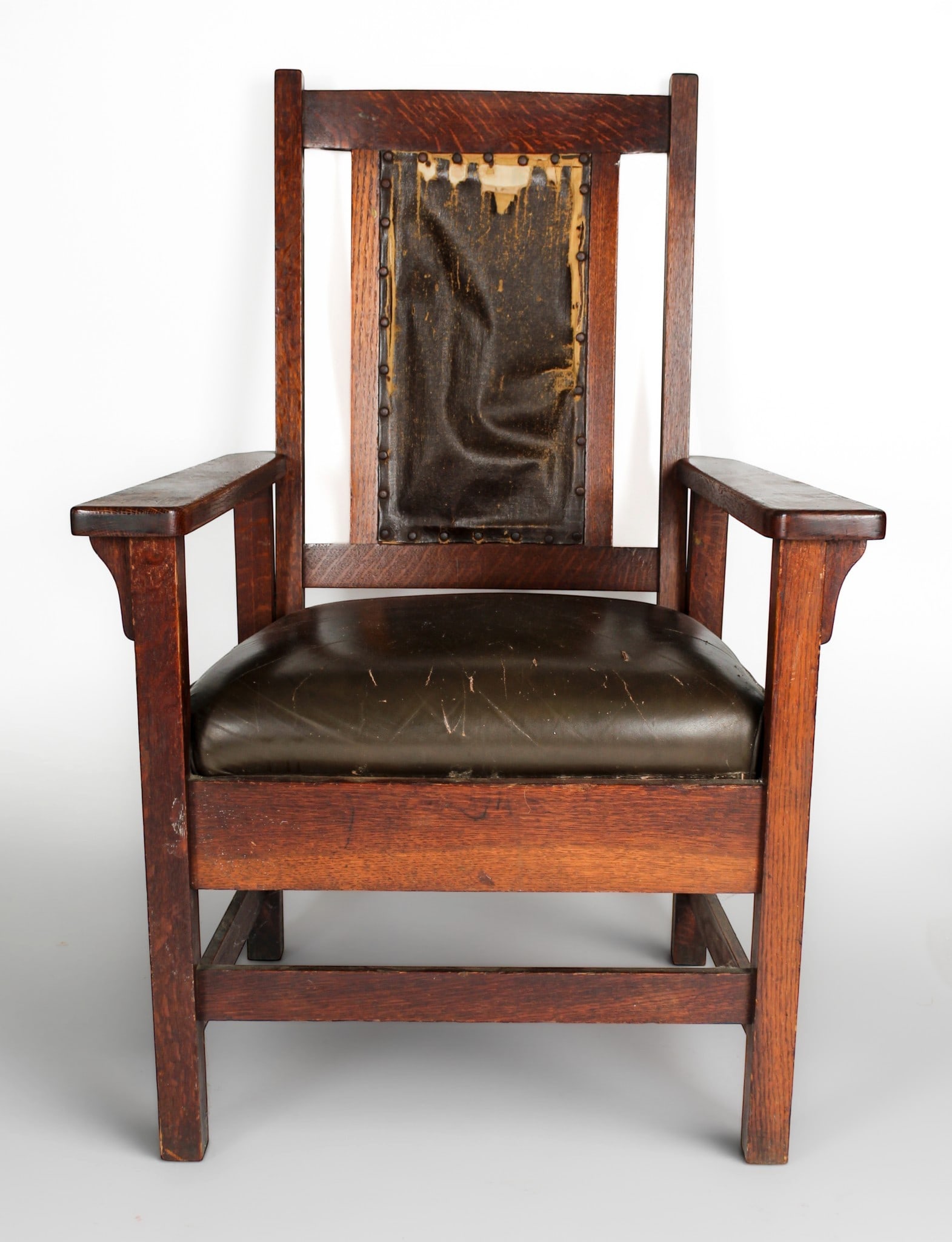 Arts & Crafts Mission Oak Armchair: Description: A leather upholstered Arts & Crafts oak armchair with brown leather upholstery. Sold to benefit the Morgan Library & Museum. Markings & Inscriptions: Unmarked Date: Early 20th century Mak