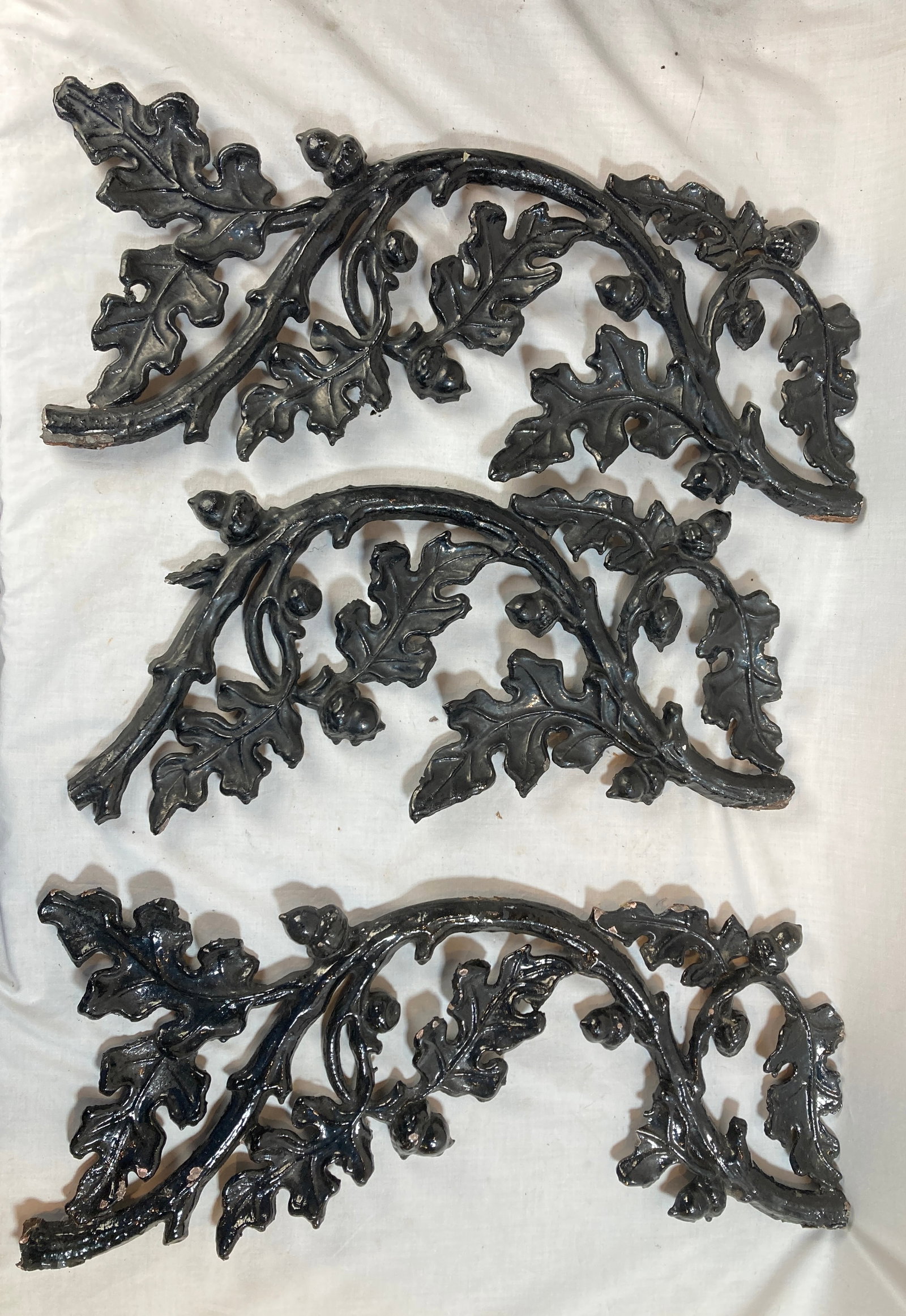 Set of 3 painted black cast iron ornamental pieces (1 of 3)