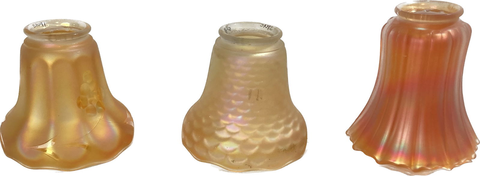 Group of 3 various unique NuArt carnival glass shades: Group of 3 various unique NuArt carnival glass shades. 2 1/4" fitters. Left: 4 1/2" tall x 4 7/8" diameter. Middle: 4 1/2" tall x 4 7/8" diameter. Right: 5 1/4" tall x 4 3/4" diameter.