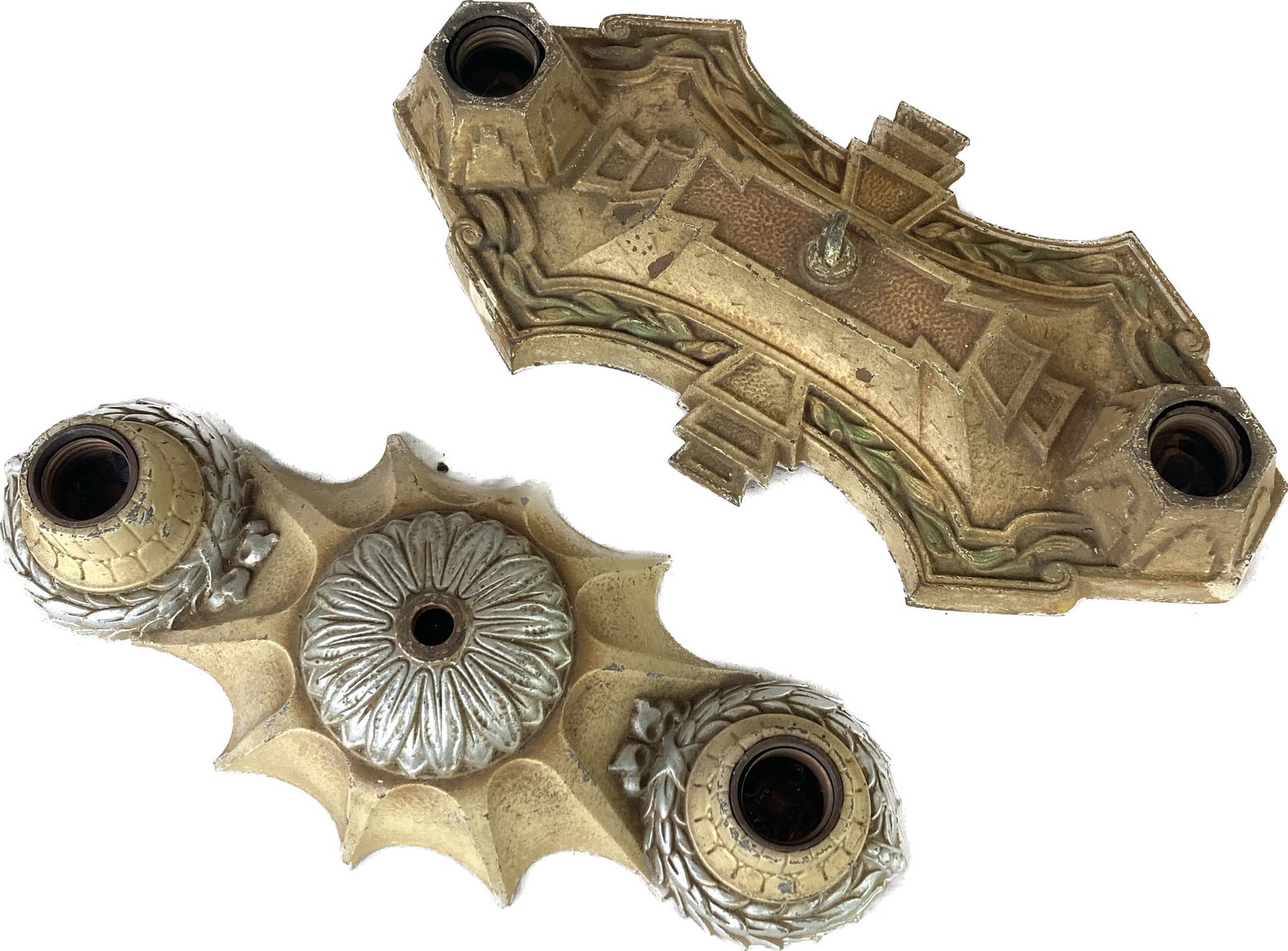 Set of 2 mismatched cast iron bare bulb flushmounts: Set of 2 mismatched cast iron bare bulb flushmounts. Silver and cream is 12 1/2" long x 5 1/2" wide x 2" deep. Polychrome is 13" long x 6" wide x 2 1/2" deep.
