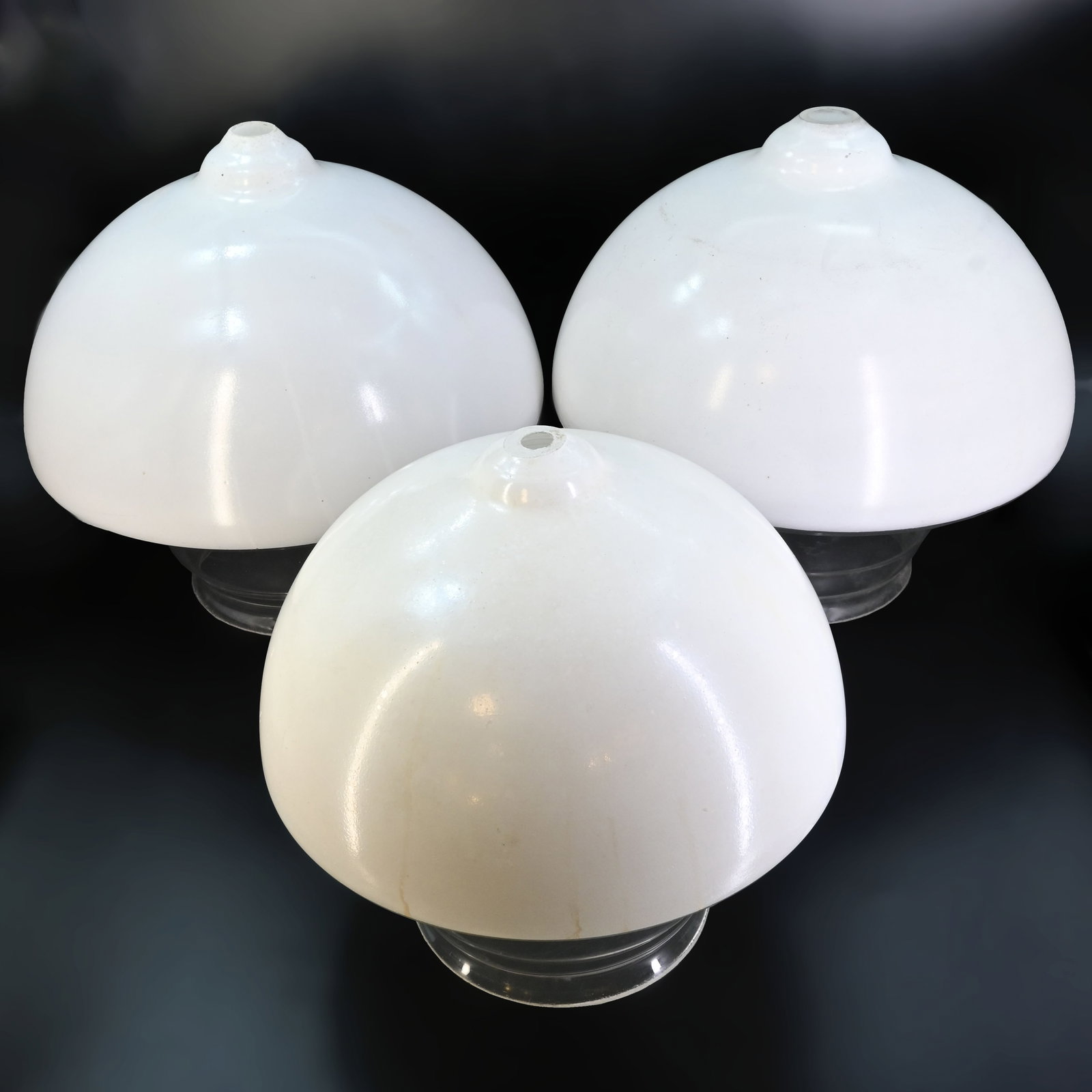 Group of three unique similar mushroom clear and white glass shades: Group of three unique matching mushroom clear and white glass shades. Left: 9 1/2" tall x 9" diameter, 5 1/8" fitter. Center: 7 1/4" tall x 7 1/2" diameter, 4 1/2" fitter. Right: 9 1/4" tall x 9 1.2" 