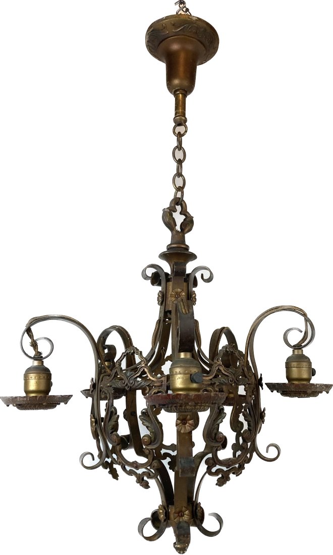 Polychrome bare bulb five arm tudor chandelier: Polychrome bare bulb five arm tudor chandelier. Stamped rosettes. Needs rewiring. Illuminated by 5 medium Edison sockets. Original finish. Made of iron and brass. Dimensions 33 1/2" drop x 19" diamete