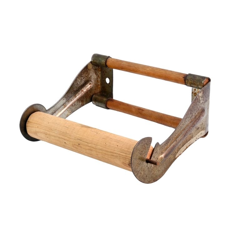 Stamped steel and wood toilet paper holder: Stamped Steel and Wood Toilet Paper Holder. 1920's. Dimensions are 5.25” wide x 3” tall x 3.75” projection. NEW OLD STOCK. This item is offered with no reserve.