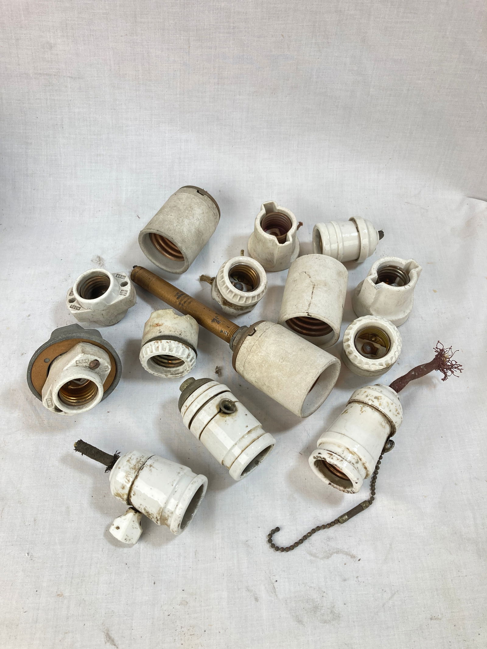 Grouping of assorted antique porcelain sockets (1 of 1)