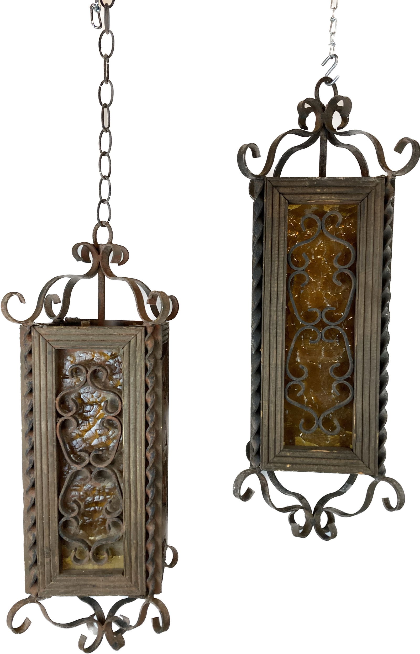 Pair of wrought iron and wood lantern pendants with curly-Q details and textured amber glass (1 of 3)