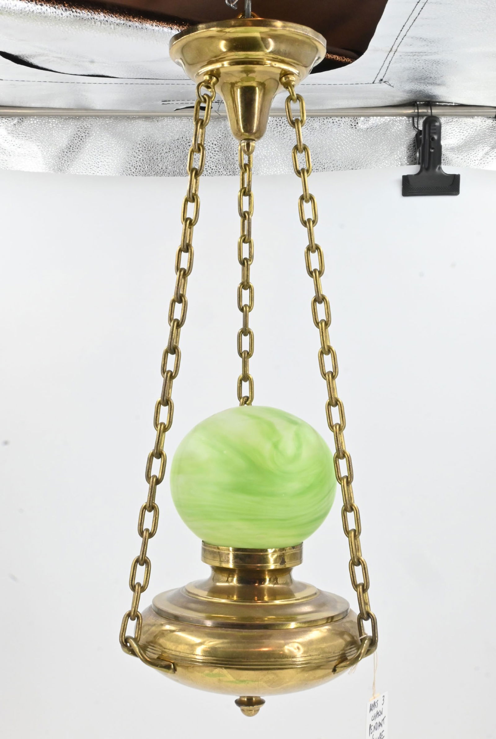 Brass three chain pendant with swirled frosted green glass globe. (1 of 9)