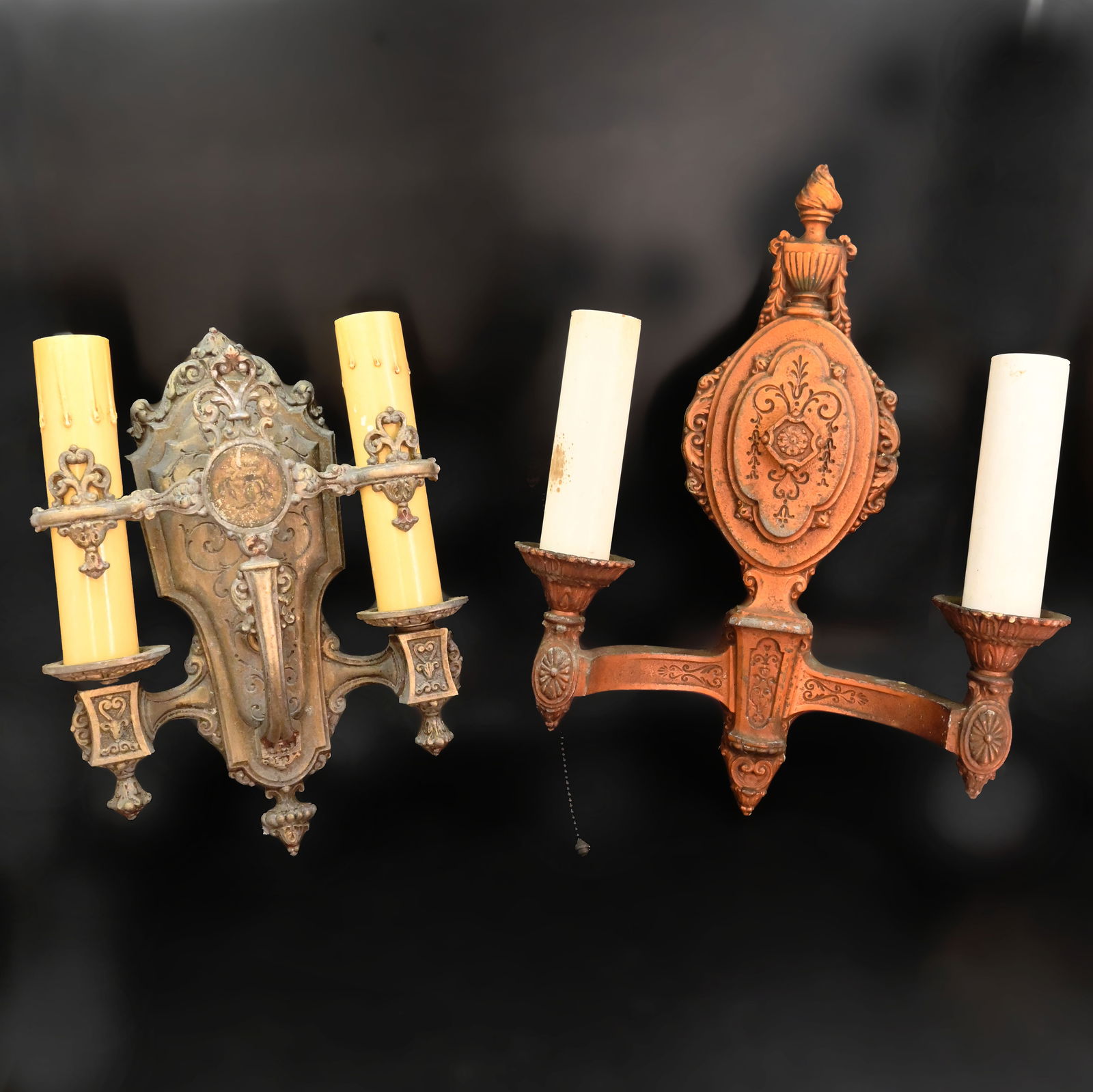 Set of two mismatched Riddle 2 candle sconces: Set of two mismatched Riddle 2 candle sconces. Left 11" tall x 8" wide x 3" projection. Right 14" tall x 10.5" wide x 4" projection. This item is offered with no reserve.