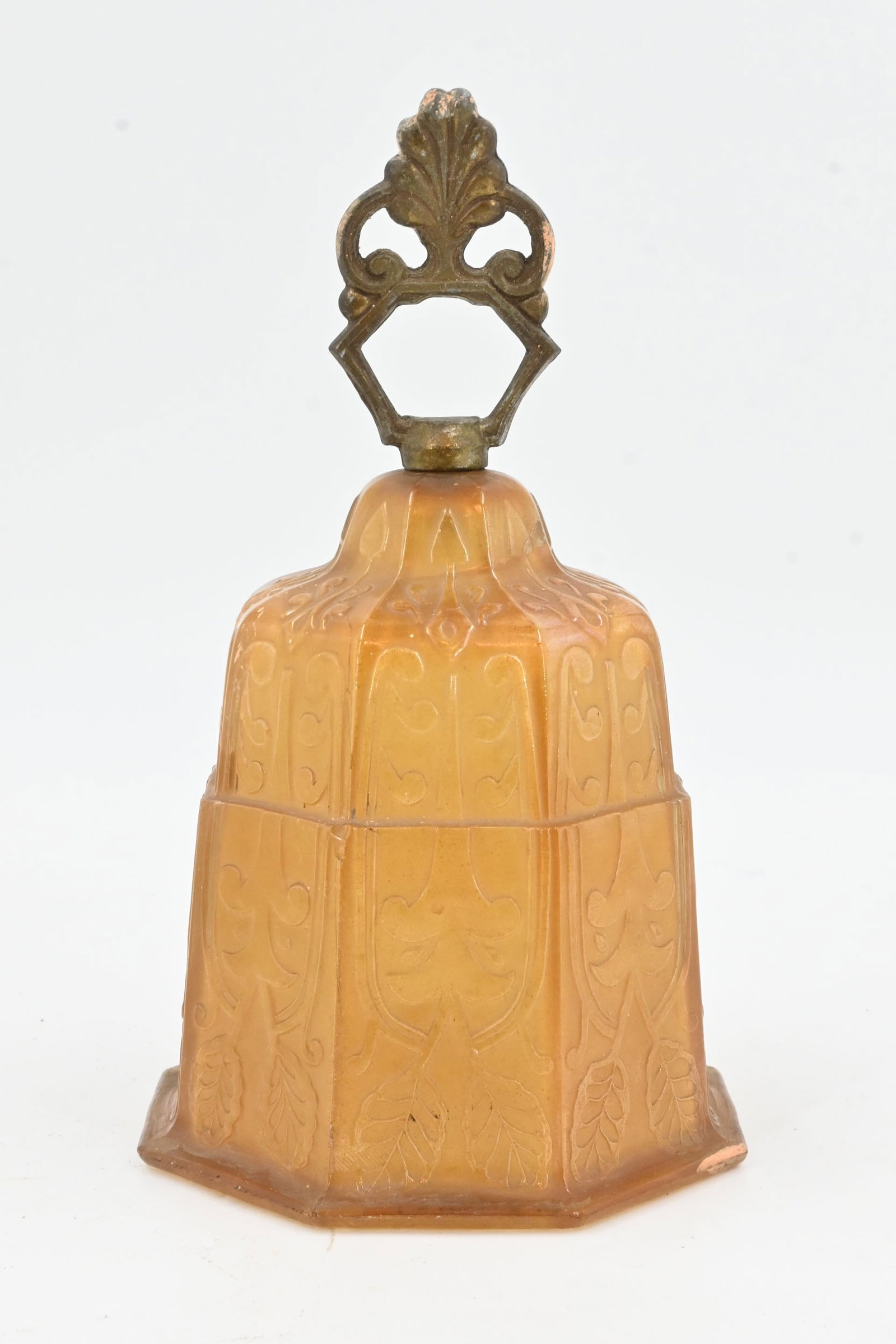 Unique cast amber glass bell with cast loop finial: Unique cast amber glass bell with cast loop finial. Cracked, see images. Material: brass plated aluminum and amber glass. 8" tall x 5" diameter. This item is offered with no reserve.