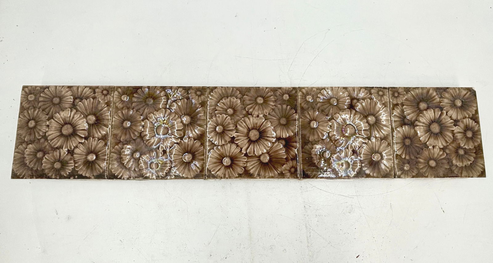 Set of five brown floral antique tiles attached to piece of slate (1 of 4)