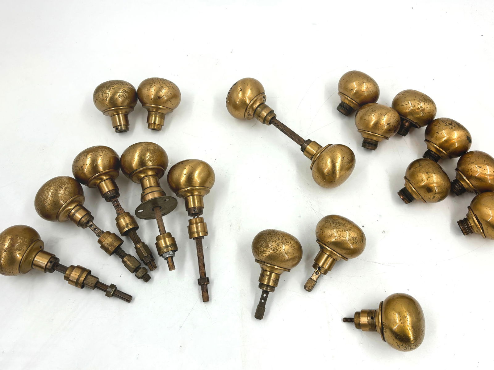 Set of 18 copper plated steel industrial doorknobs with 6 spindles: Set of 18 copper plated steel industrial doorknobs with 6 spindles. Knobs are 2.25" diameter. This item is offered with no reserve.