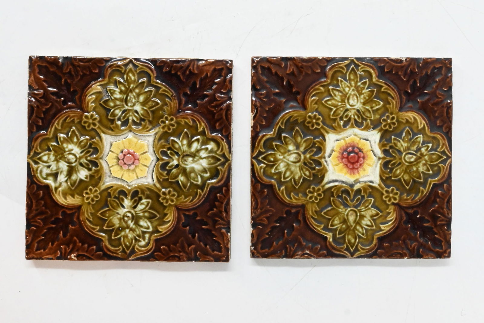 Pair of victorian six inch square glazed tile with quad floral design & center flower (1 of 2)