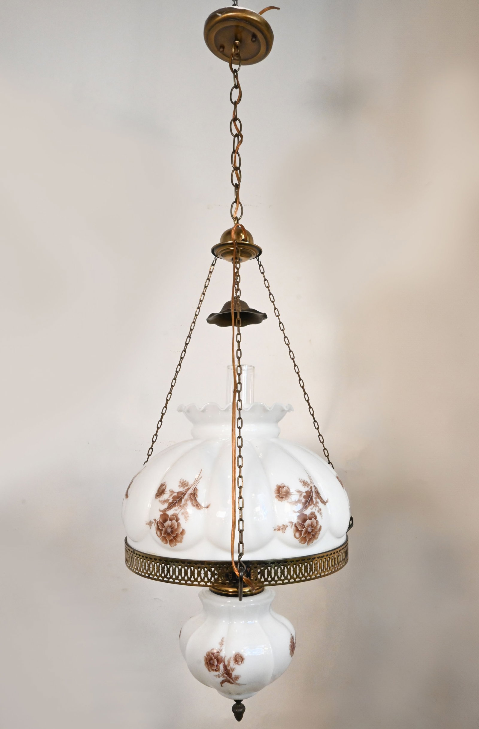 Brown floral glass stenciled converted victorian oil/kerosene lamp pendant: Brown floral glass stenciled converted victorian oil/kerosene lamp pendant. Material: brass plated steel and brass, stenciled milkglass. One medium Edison socket. Dimensions: 47 inch total length x 18