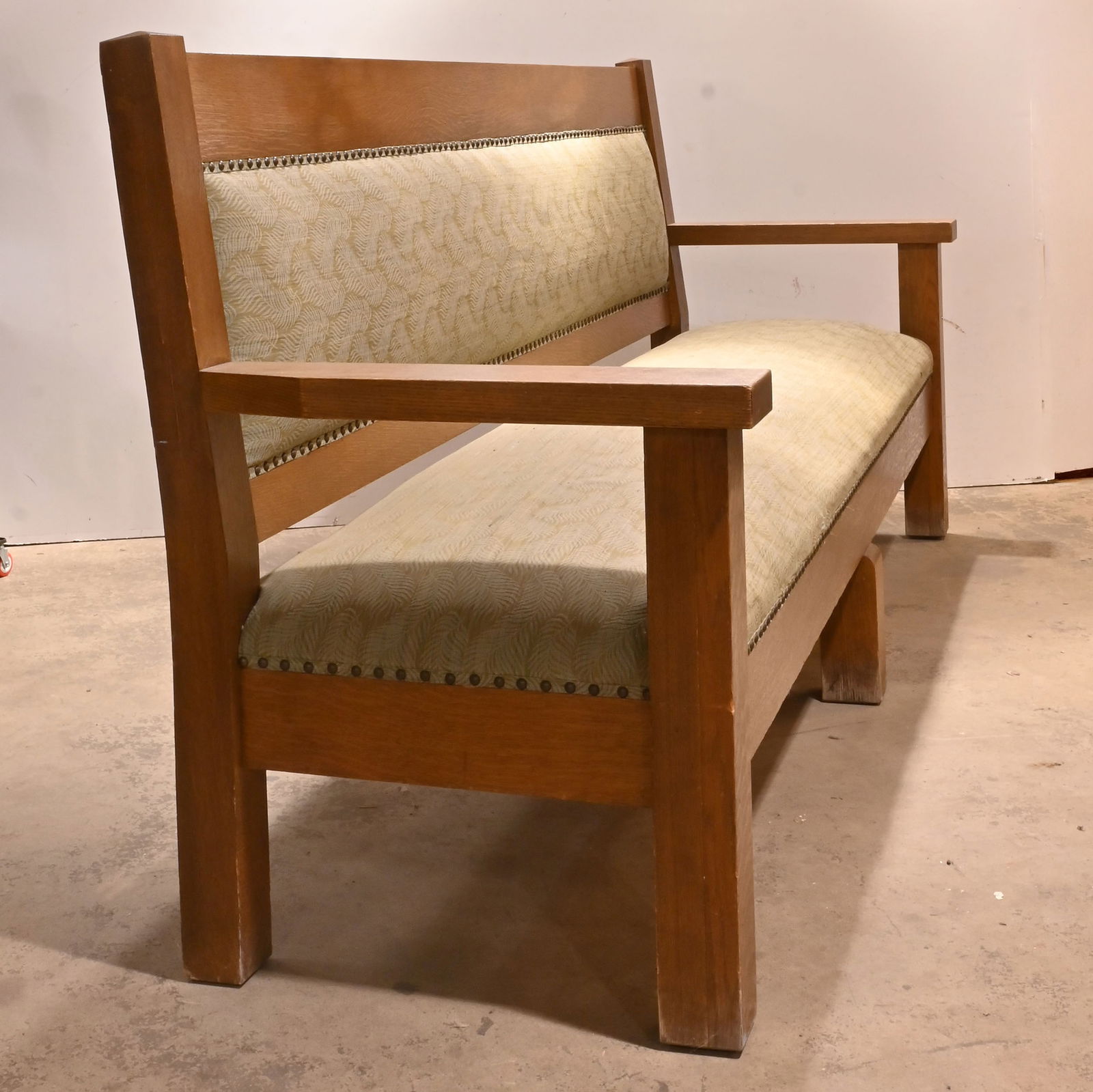 Pair of eight foot upholstered oak settees: Pair of eight foot upholstered oak settees. Material: Oak, Fabric. Condition: Age Consistent / Reupholstered. Dimensions: 96 inches long at front x 39.5 inch tall back, 18 inch high seat x 27 inches d